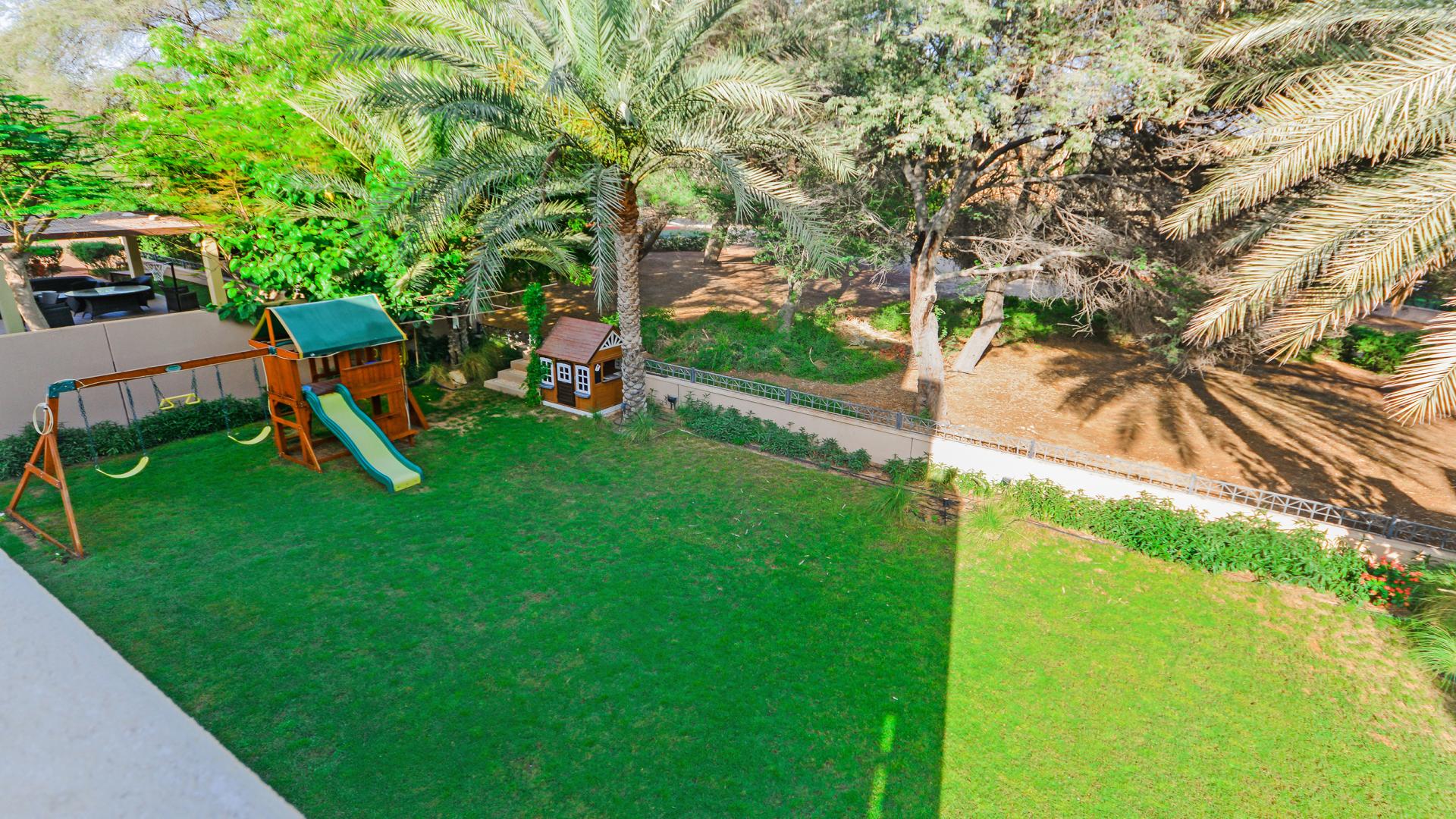 Expansive garden with playset at 3-bedroom villa in Saheel 1, Arabian Ranches