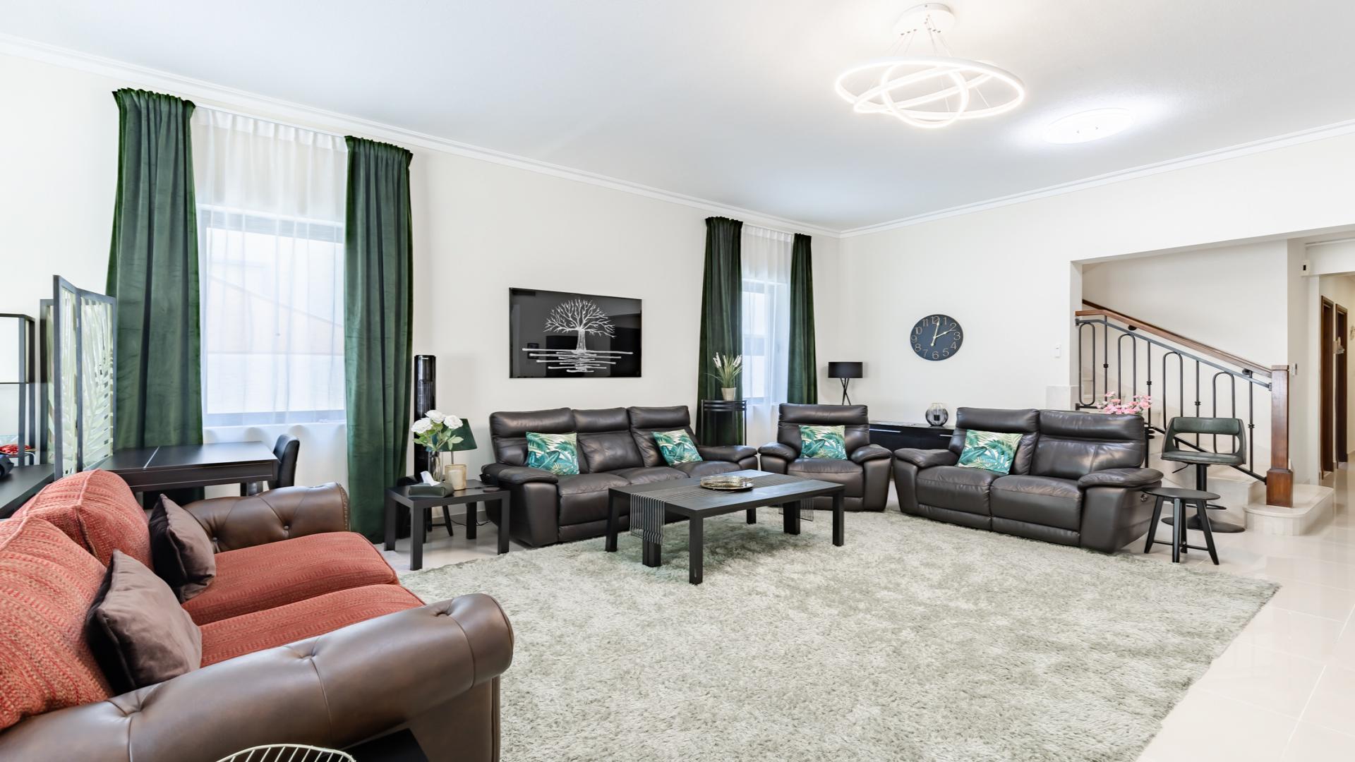 "Spacious patio and garden of 5-bedroom villa in Samara, Arabian Ranches 2 for rent.",Luxurious living room in 5-bedroom villa, Samara, Arabian Ranches 2, spacious and elegant design