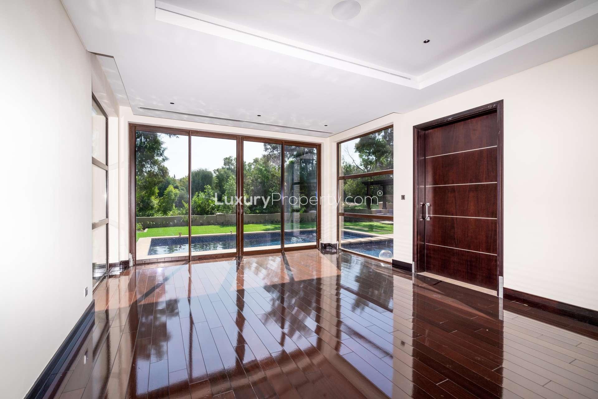 Modern luxury villa exterior in Sanctuary Falls, Jumeirah Golf Estates, available for rent