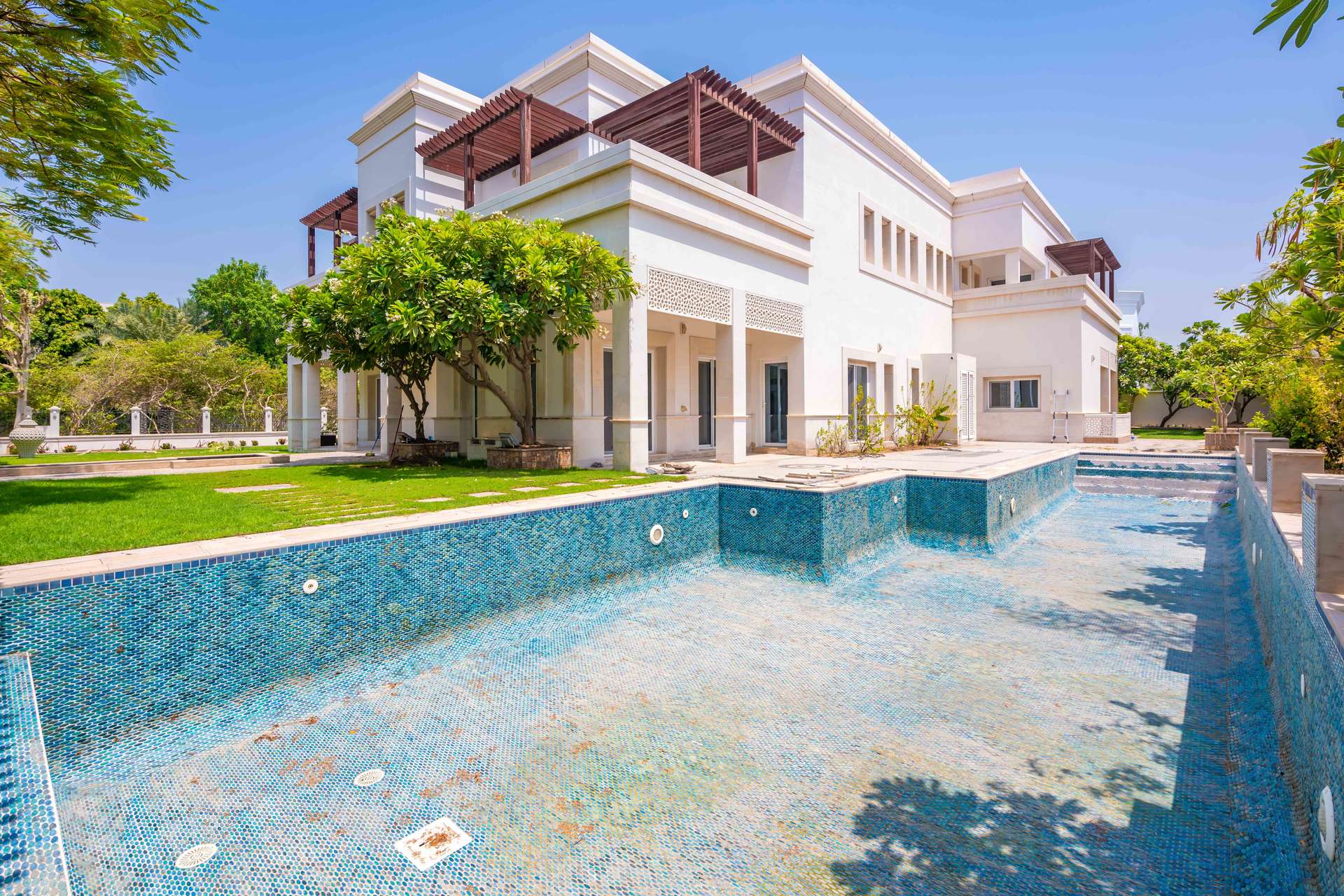 Grand chandelier and elegant marble foyer in Emirates Hills Mediterranean villa, Sector E