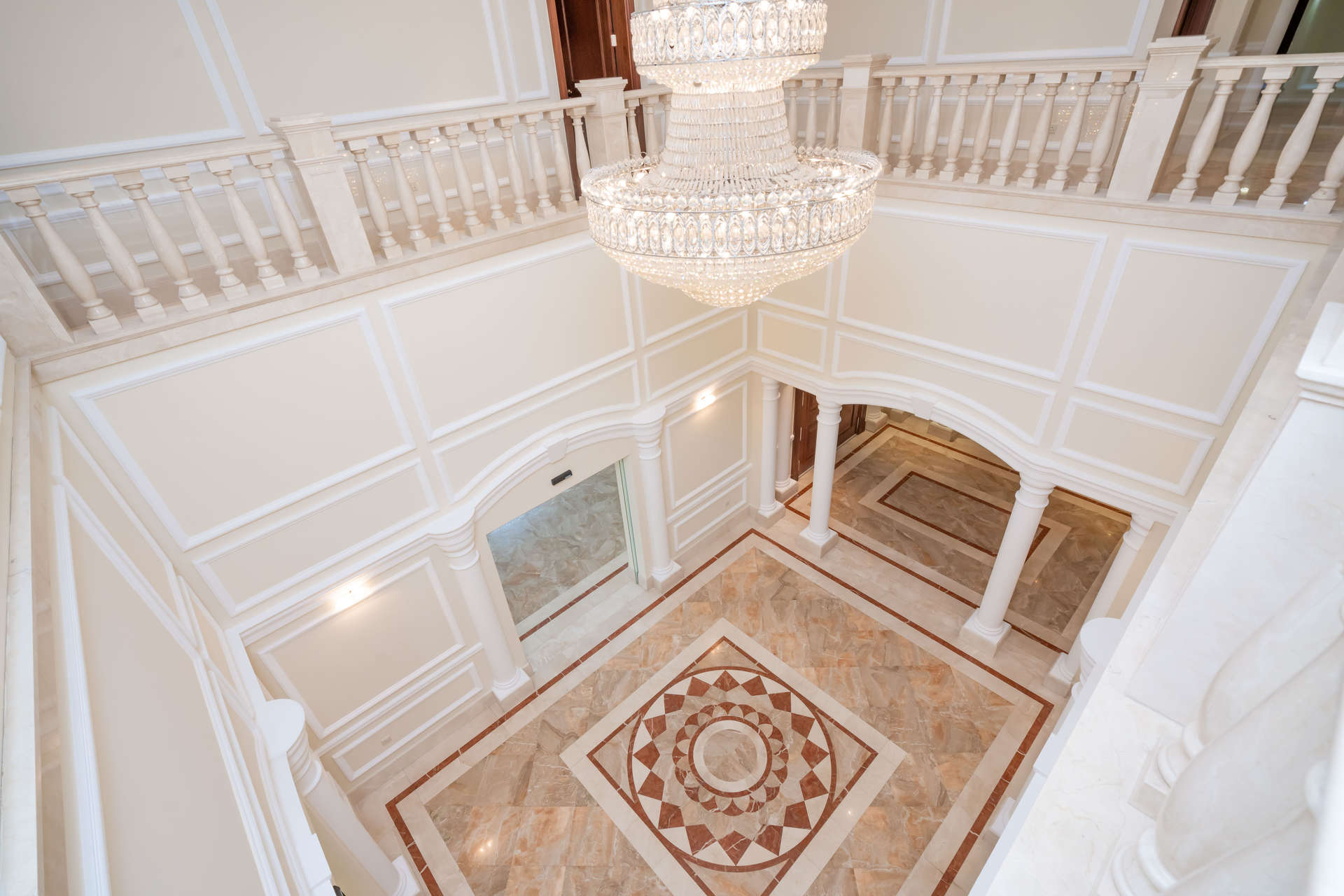 Exquisite Mediterranean villa exterior with palm trees in Emirates Hills, Sector E, for rent