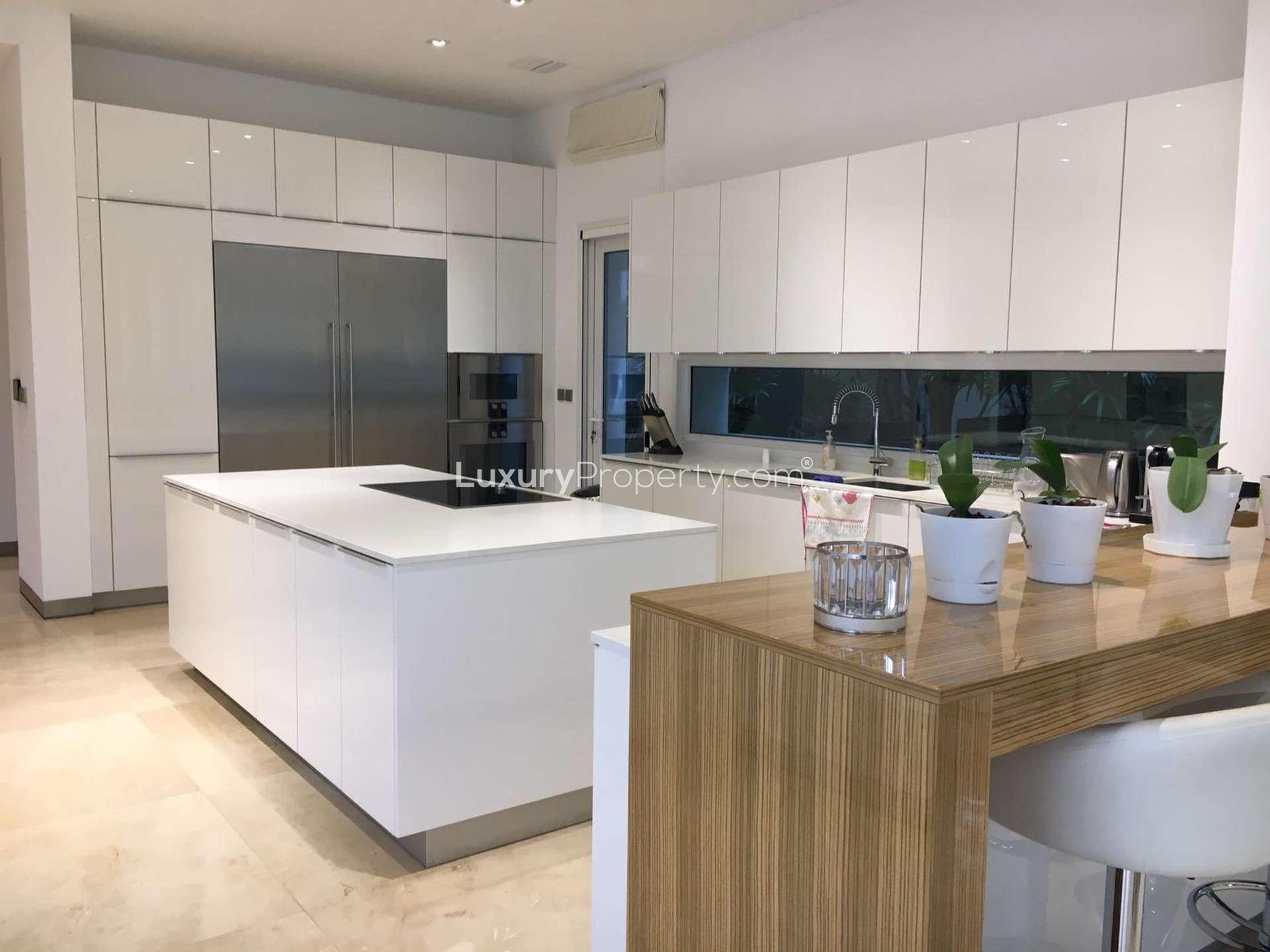 Modern kitchen in fully furnished 5-bedroom villa for rent, Emirates Hills, Sector R