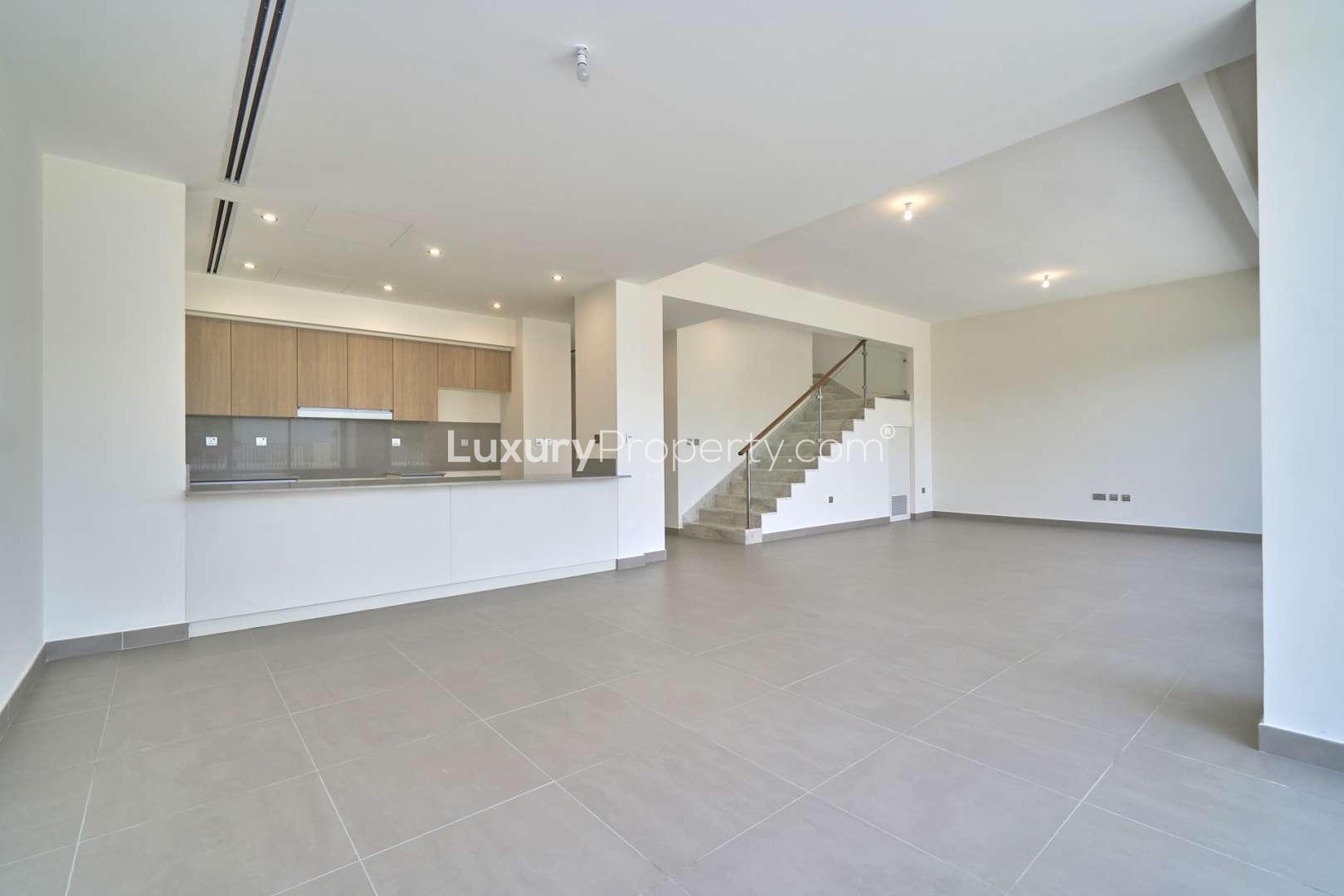 Spacious living area with open kitchen in 5-bedroom villa, Dubai Hills Estate