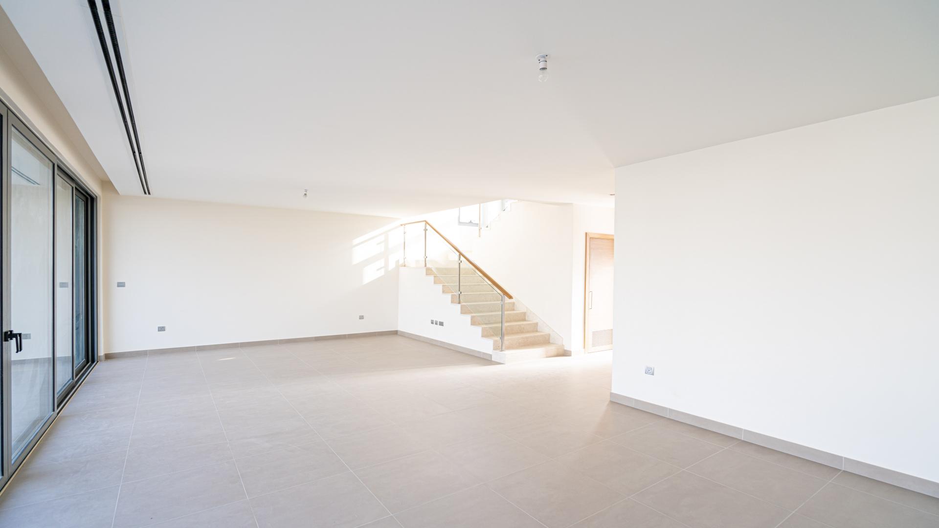 Modern open-plan kitchen and living area in Sidra Villas, Dubai Hills Estate