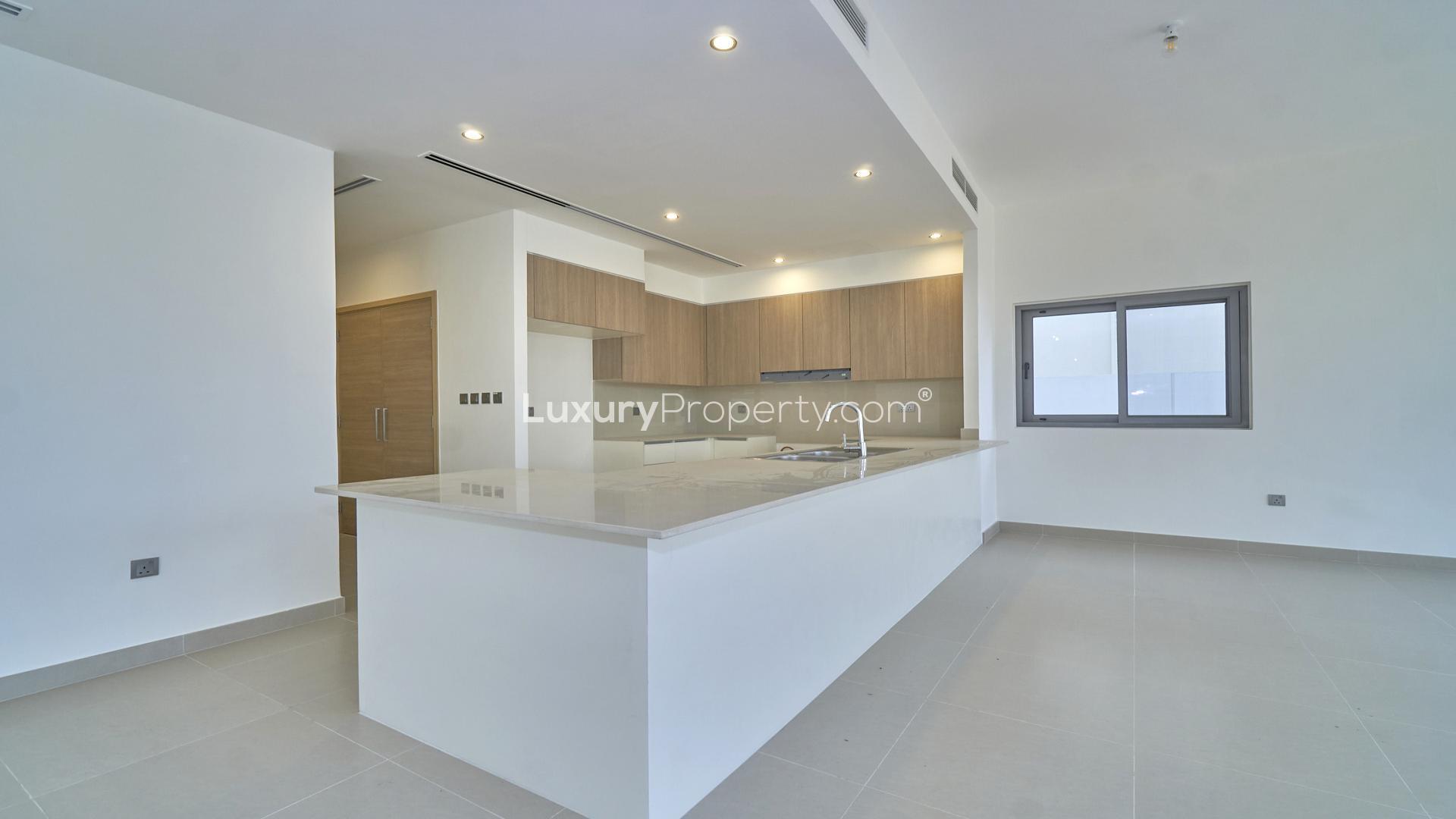 Modern open-plan kitchen and living area in Sidra Villas, Dubai Hills Estate