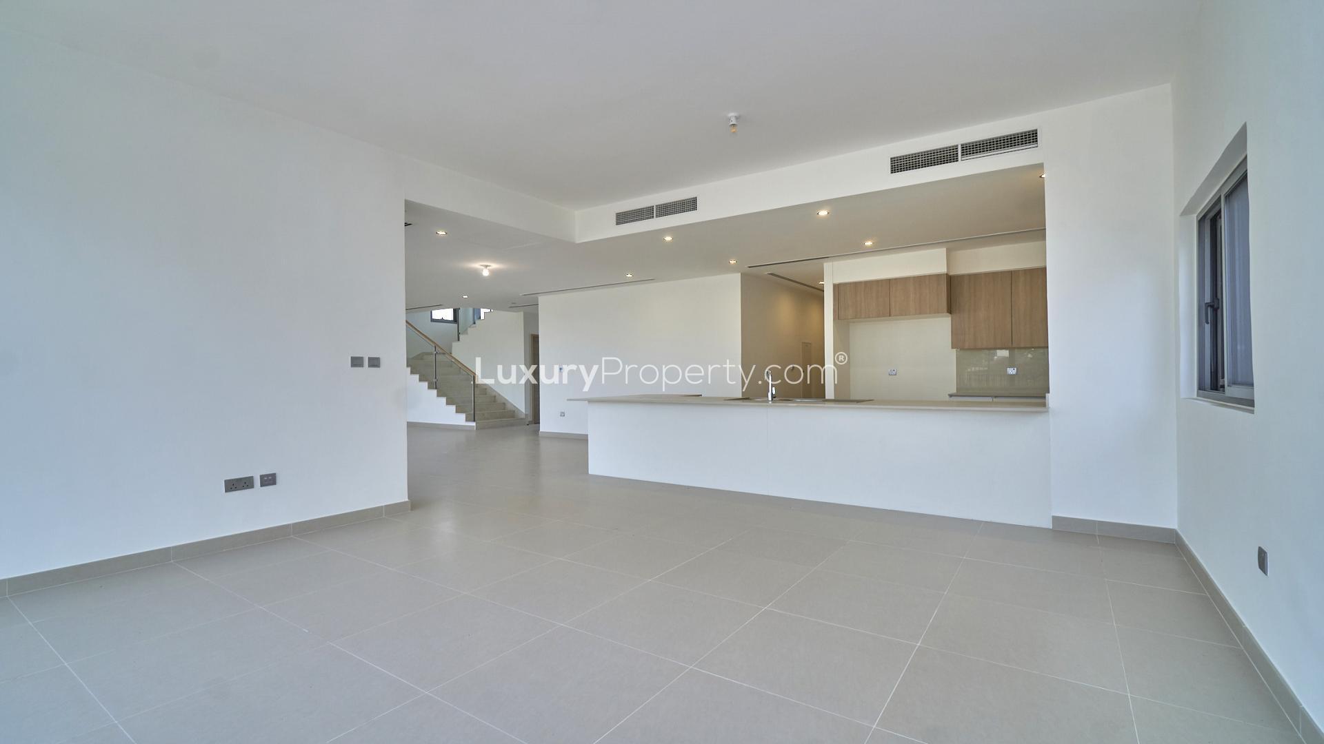 Modern villa interior with open-plan kitchen and staircase, Sidra Villas, Dubai Hills Estate