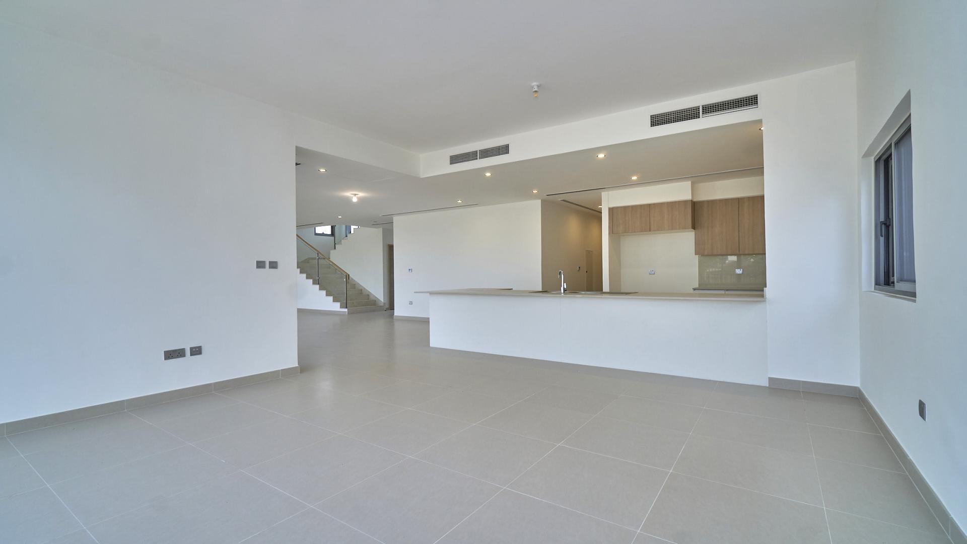Modern villa interior with open-plan kitchen and staircase, Sidra Villas, Dubai Hills Estate
