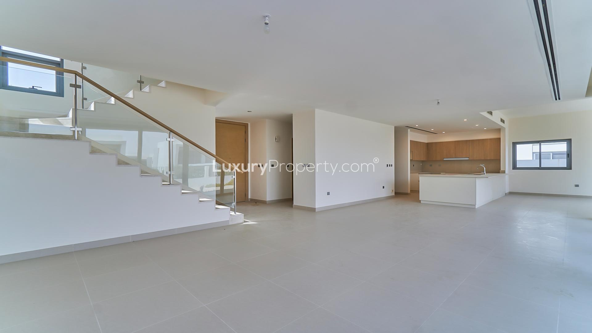 Open-plan living area with modern kitchen in Sidra Villas, Dubai Hills Estate