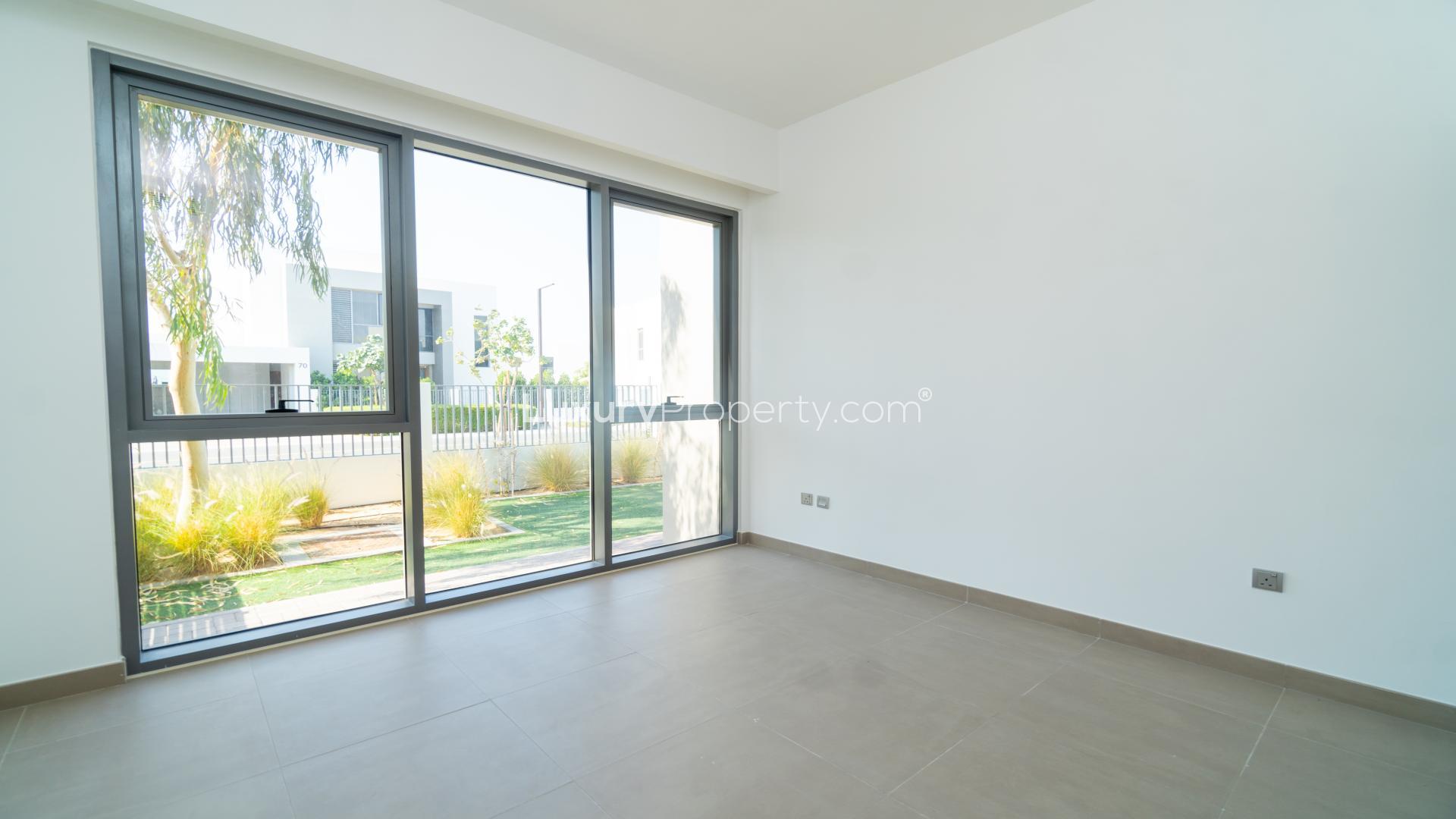 Spacious living area in Sidra Villas, Dubai Hills Estate, with modern staircase and open layout