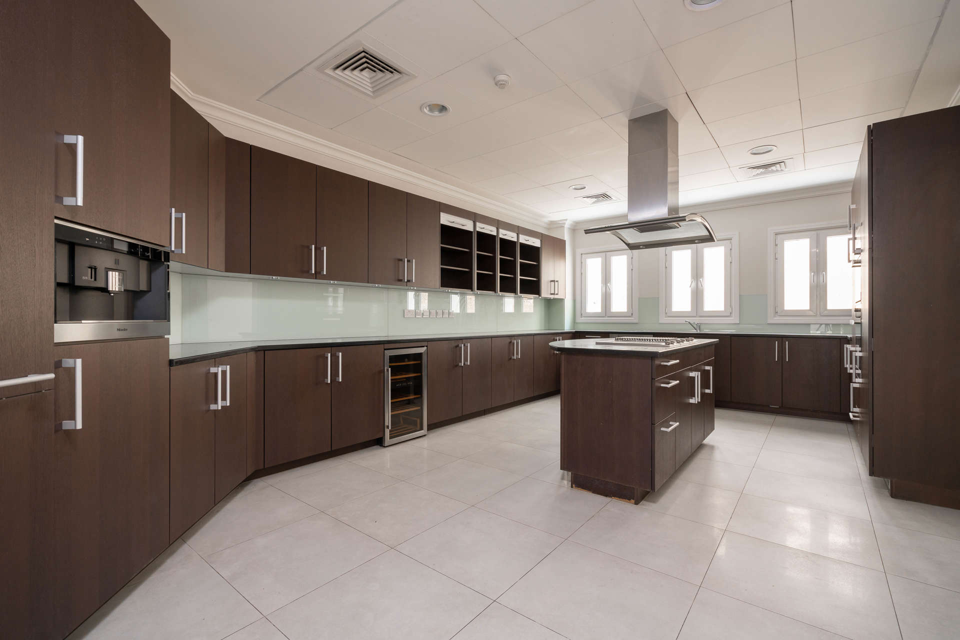 Elegant Santa Fe villa exterior in Sienna Lakes, Jumeirah Golf Estates, with lush greenery