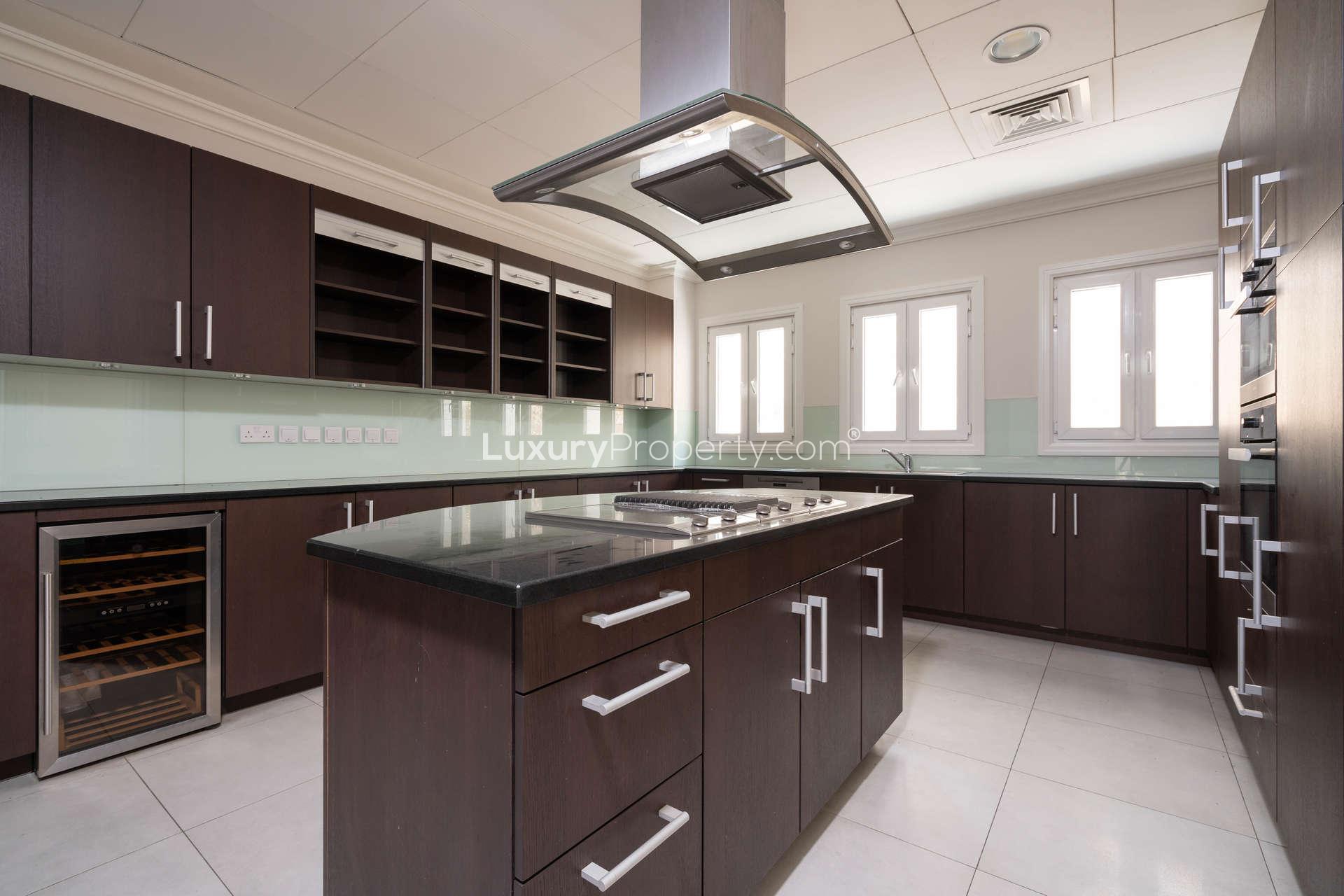 Modern kitchen with dark wood cabinets in Santa Fe villa, Sienna Lakes, Jumeirah Golf Estates
