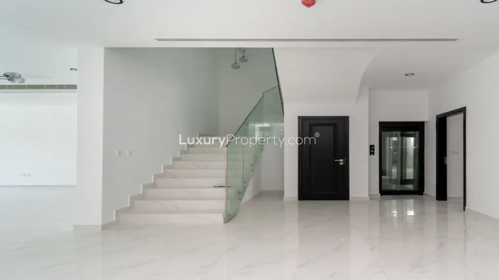 Spacious living area in luxury villa, elegant lighting, Jumeirah Park Homes, Dubai rental