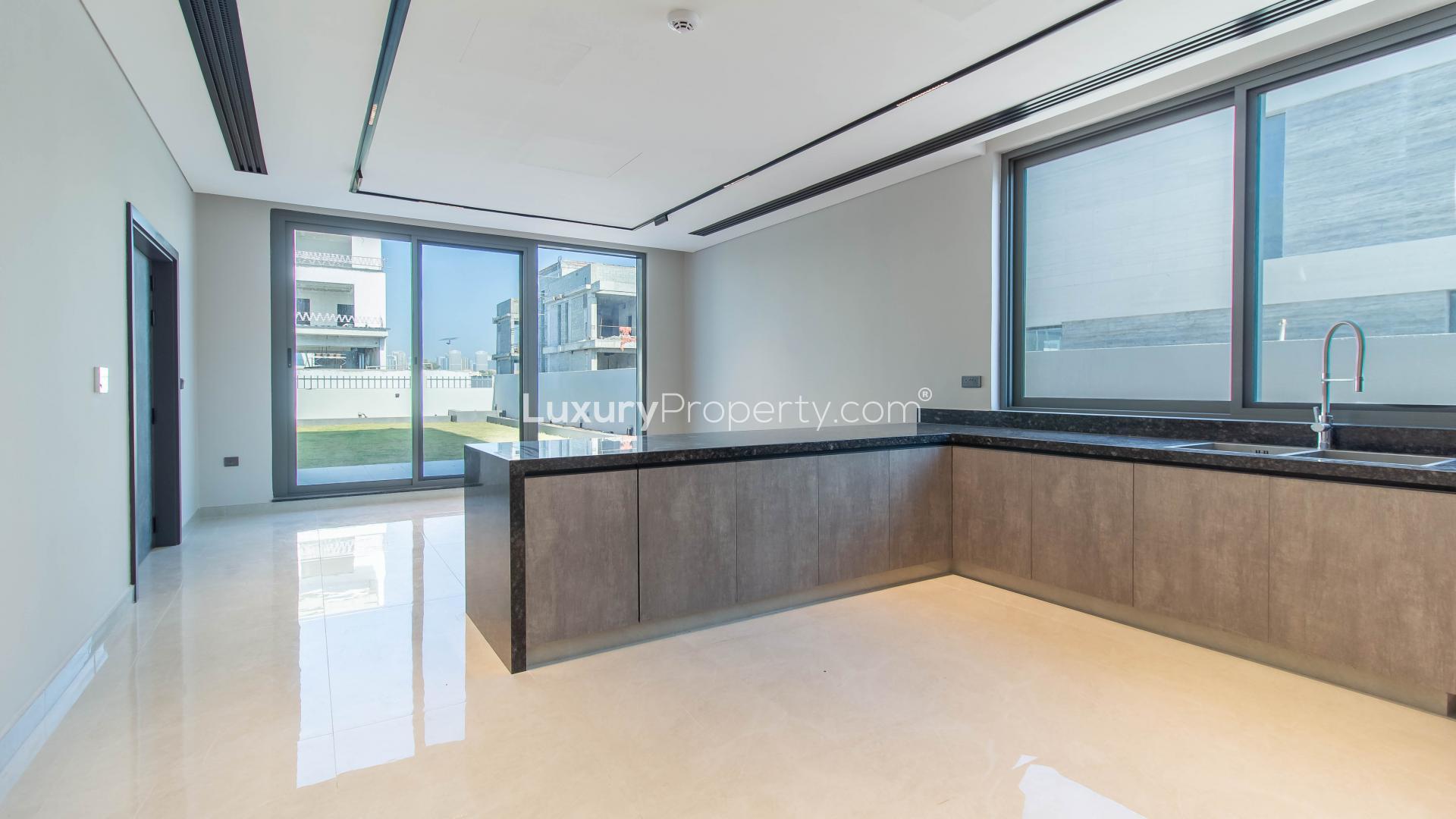 Exterior of custom-built 5-bedroom villa for rent in Jumeirah Park, spacious lawn view