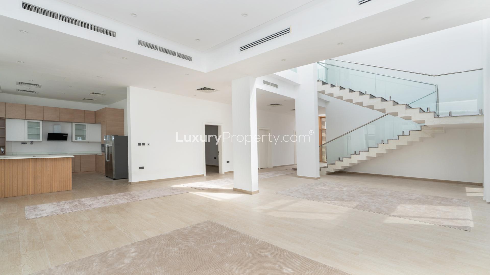 Modern 5-bedroom villa exterior with private pool in Jumeirah Park, available for rent