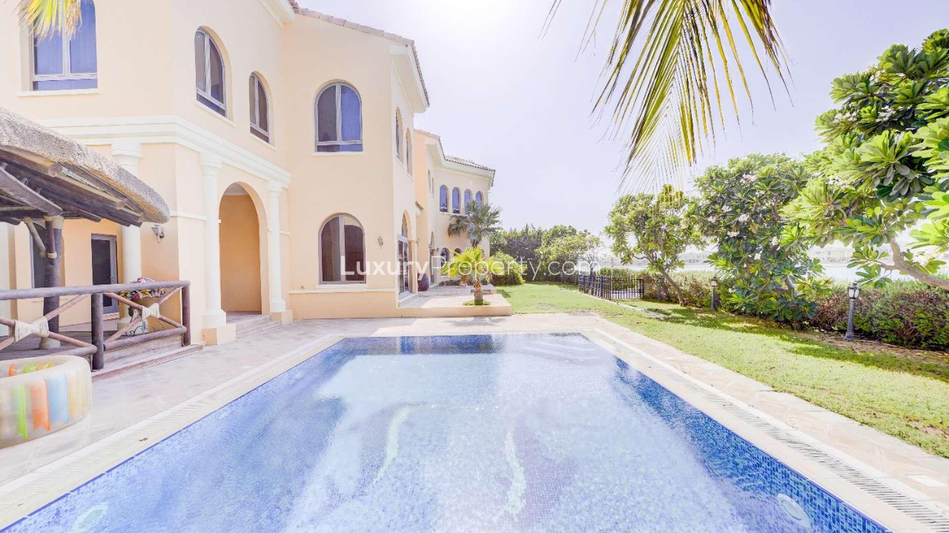 Luxury 5-bedroom villa exterior in Palm Jumeirah, featuring elegant architecture and lush landscaping