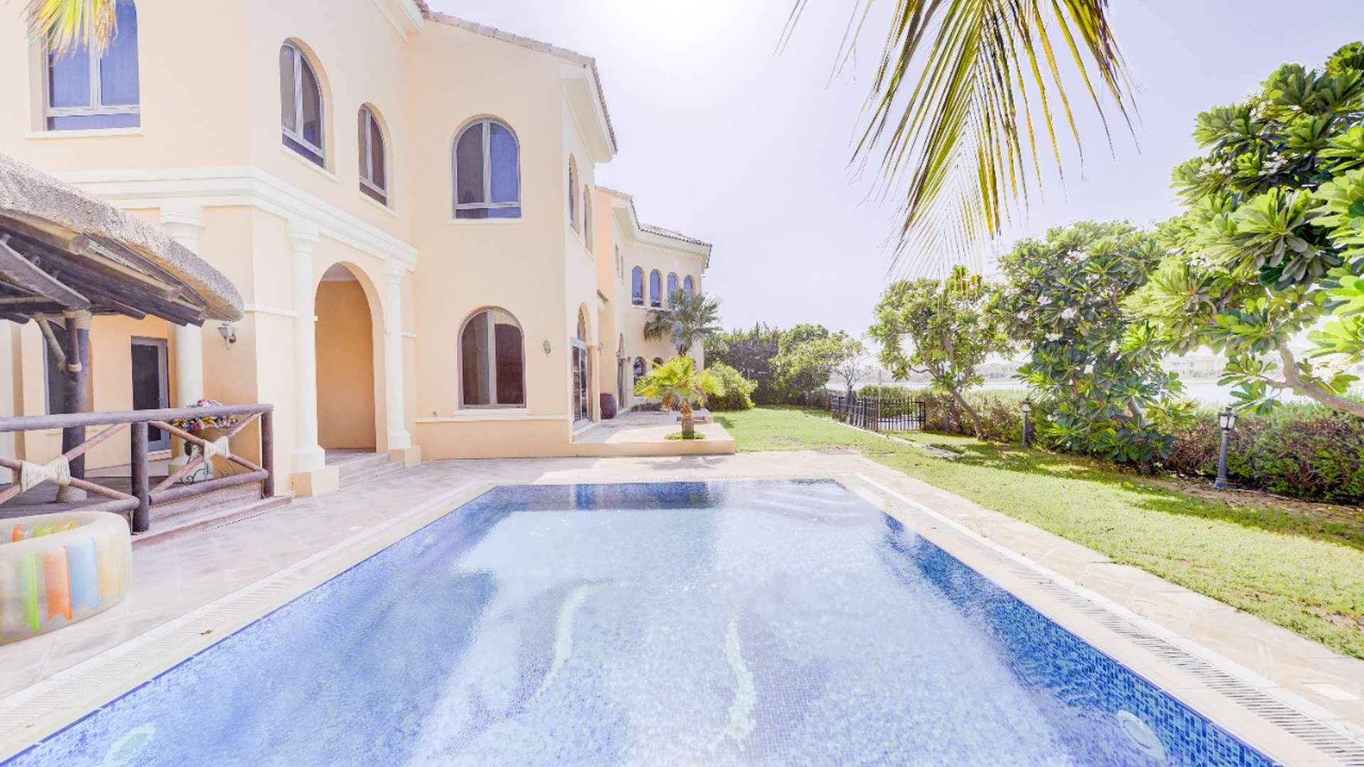 Luxury 5-bedroom villa exterior in Palm Jumeirah, featuring elegant architecture and lush landscaping