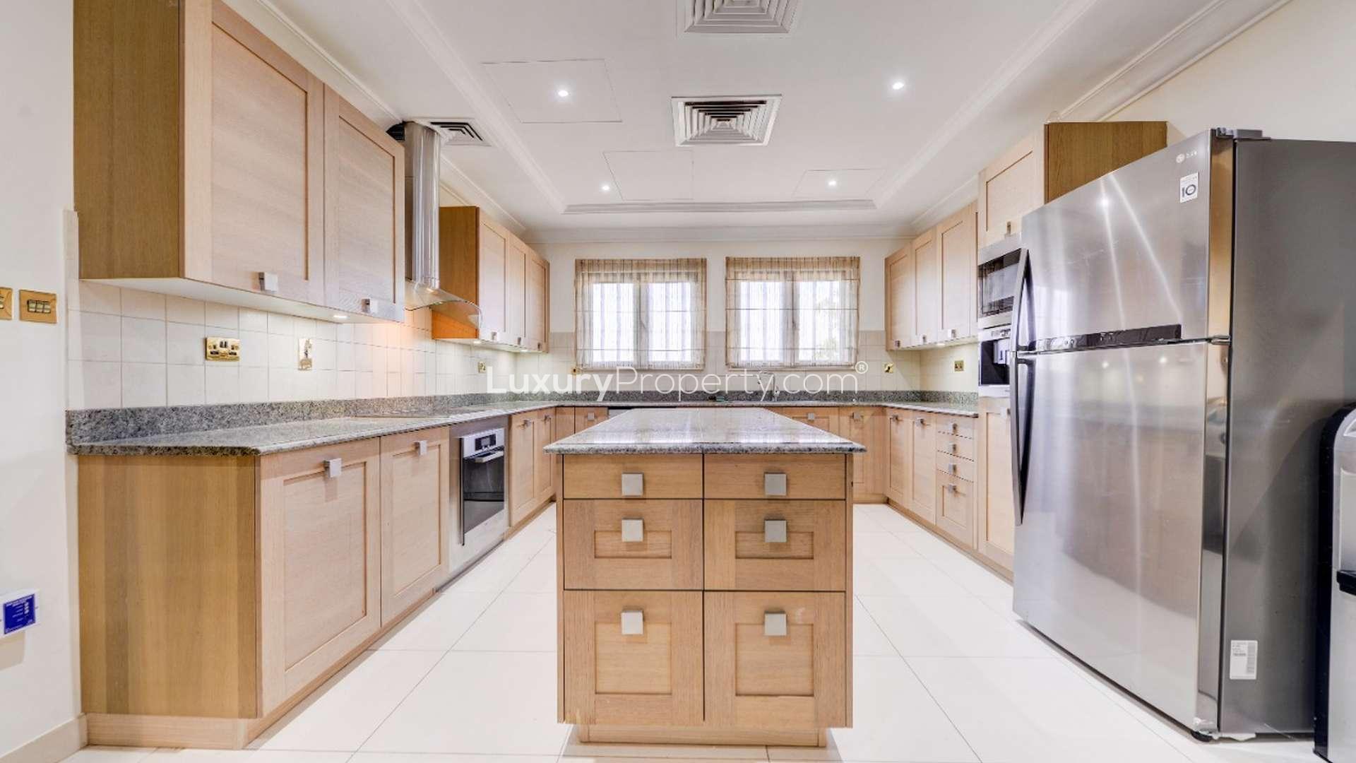 Luxurious living room in Palm Jumeirah villa with elegant decor and large windows