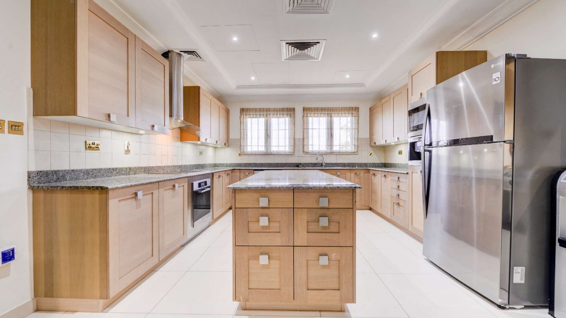 Luxurious living room in Palm Jumeirah villa with elegant decor and large windows