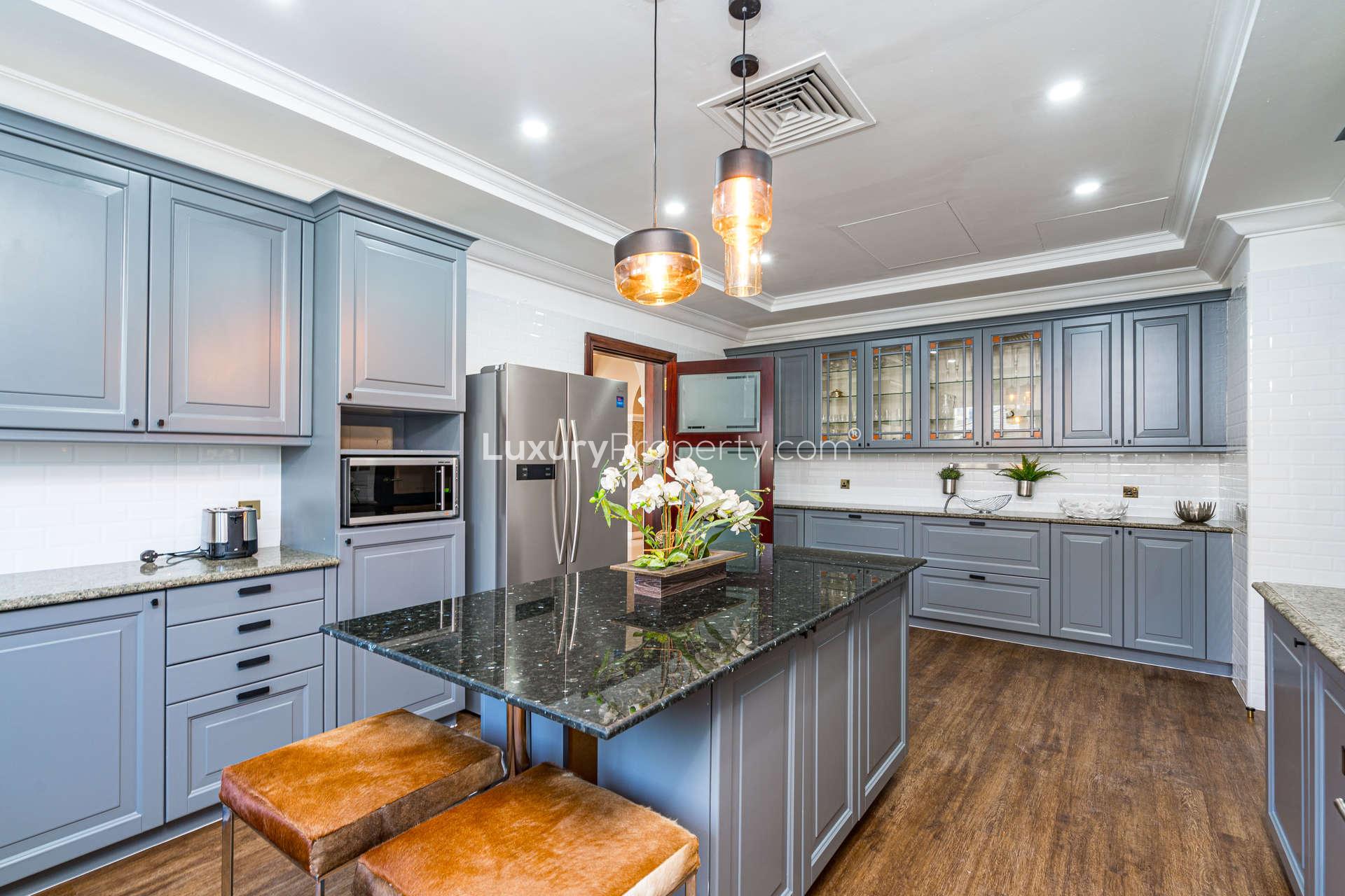 Luxurious kitchen in fully furnished Mediterranean villa, Palm Jumeirah, with modern appliances and decor