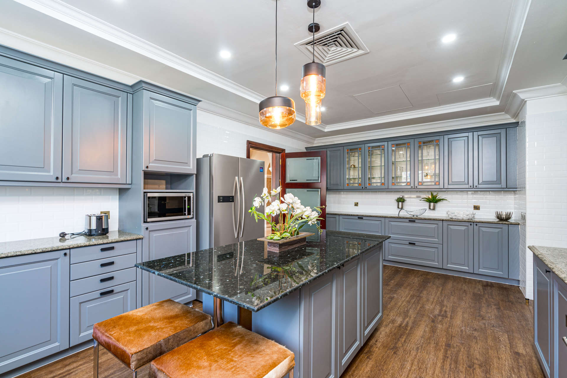 Luxurious kitchen in fully furnished Mediterranean villa, Palm Jumeirah, with modern appliances and decor