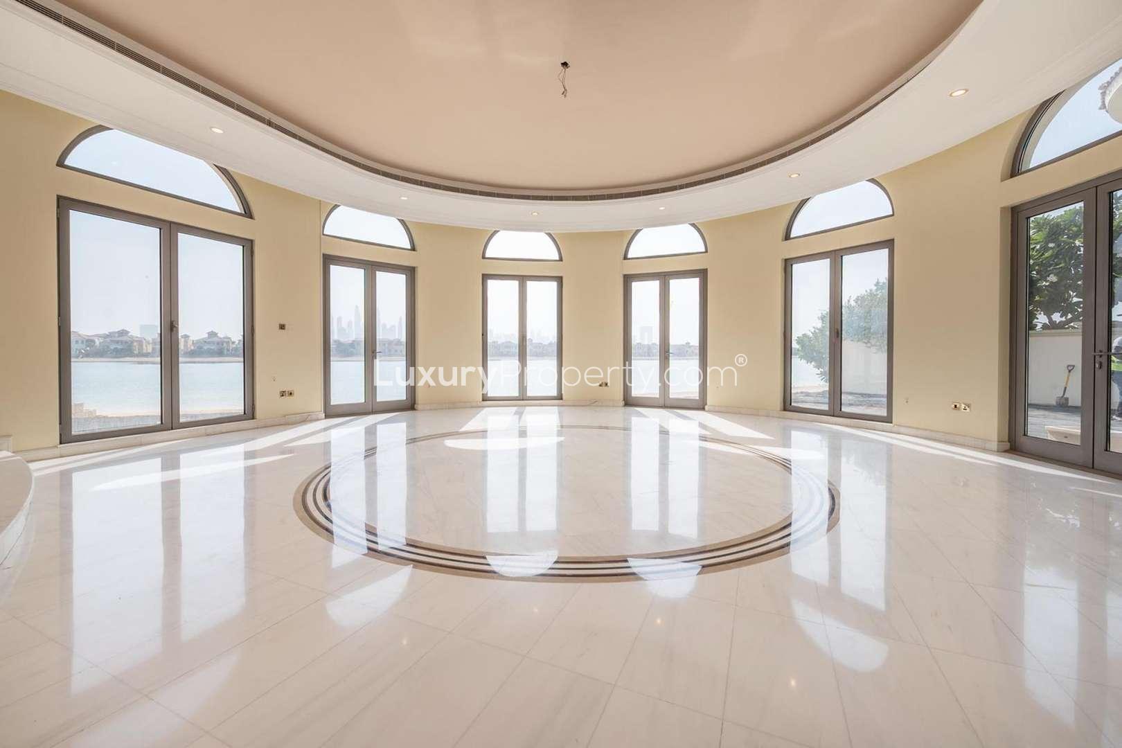 Spacious living room in beachfront villa, Palm Jumeirah, with large windows and marble flooring