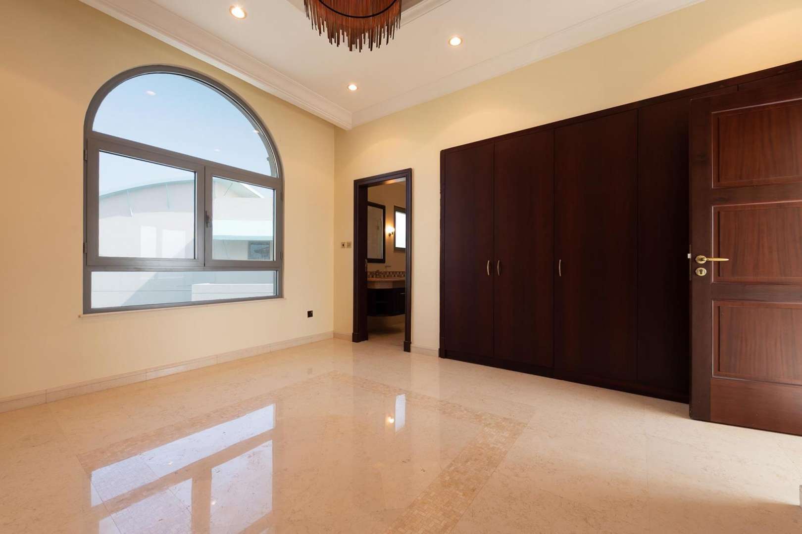 Spacious living area in beachfront villa, Palm Jumeirah, with stunning sea view windows