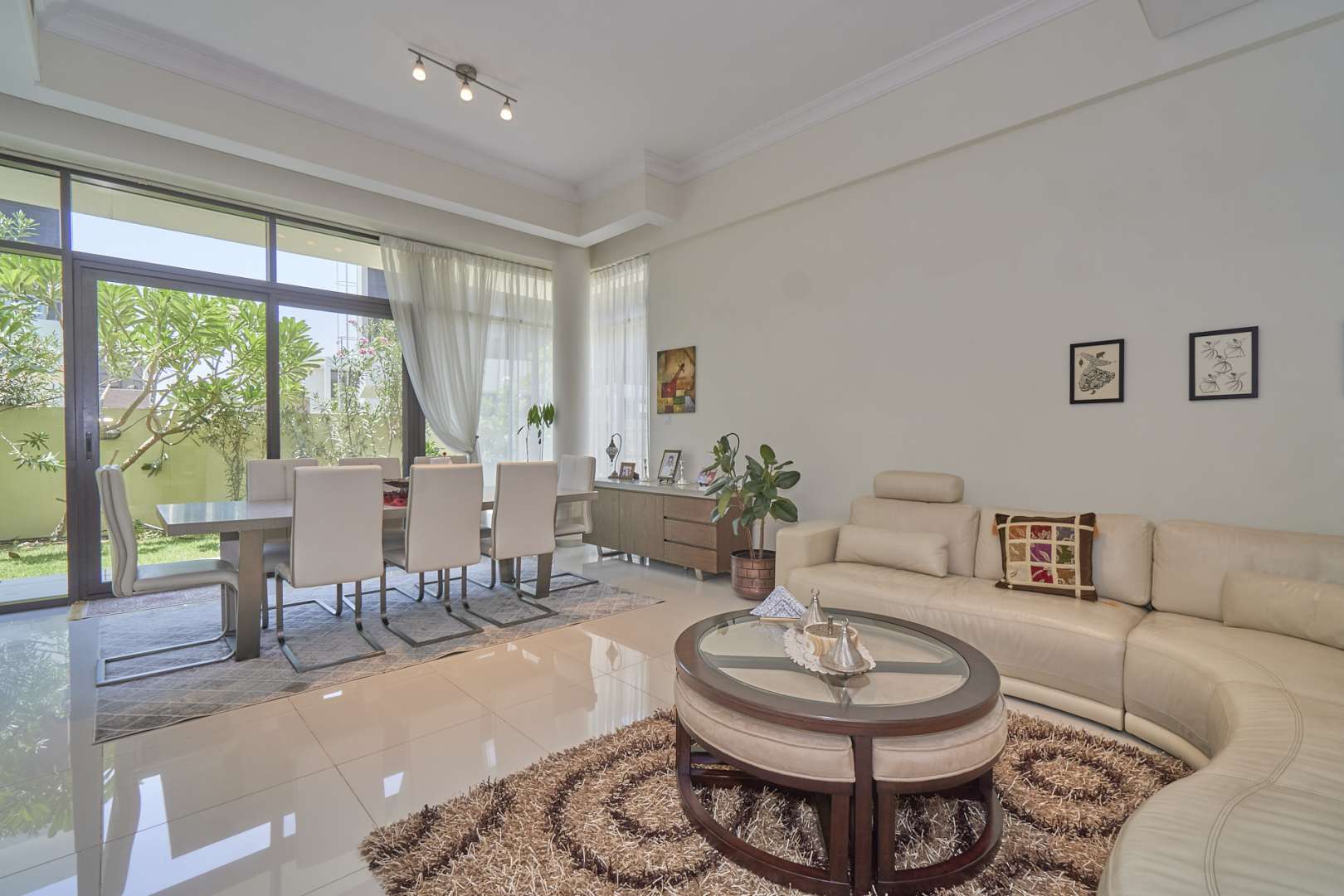 Modern villa pool with palm trees in Damac Hills, Silver Springs community
