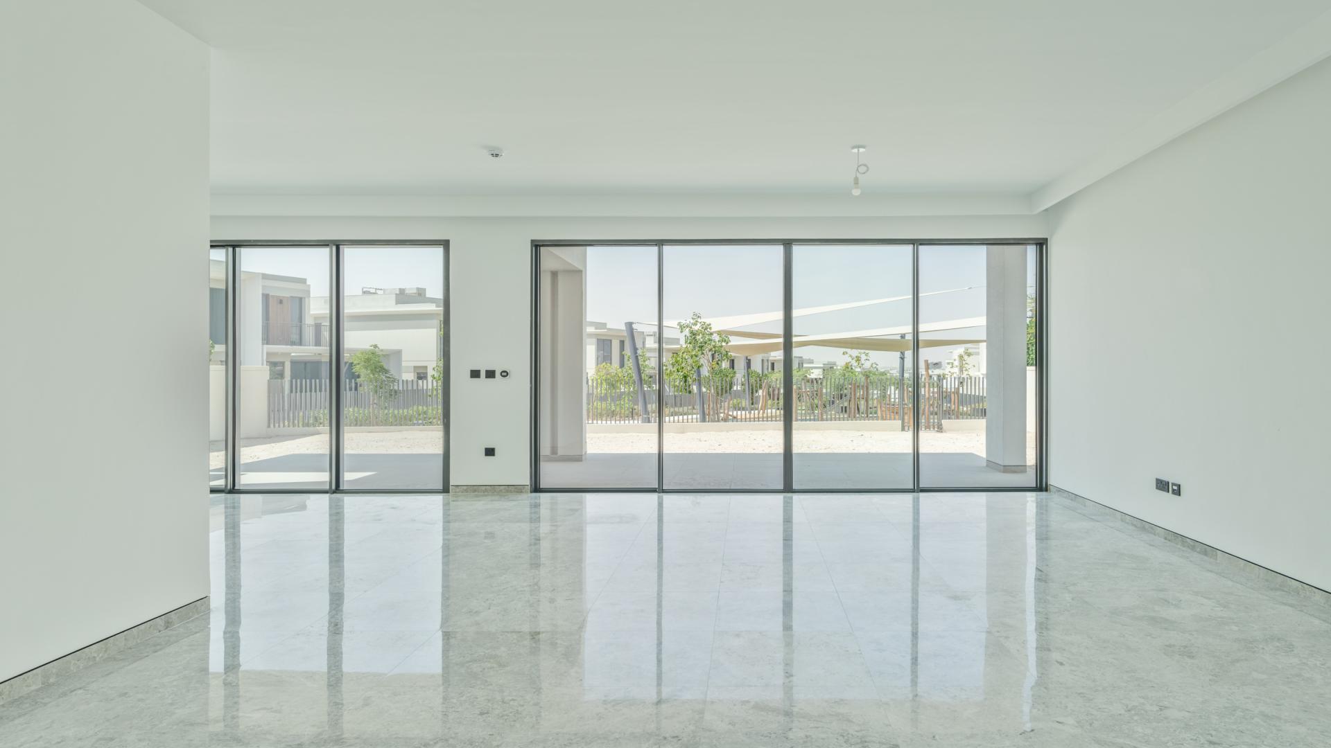 Modern 5-bedroom villa exterior in Tilal Al Ghaf, Harmony community, park-facing, for rent