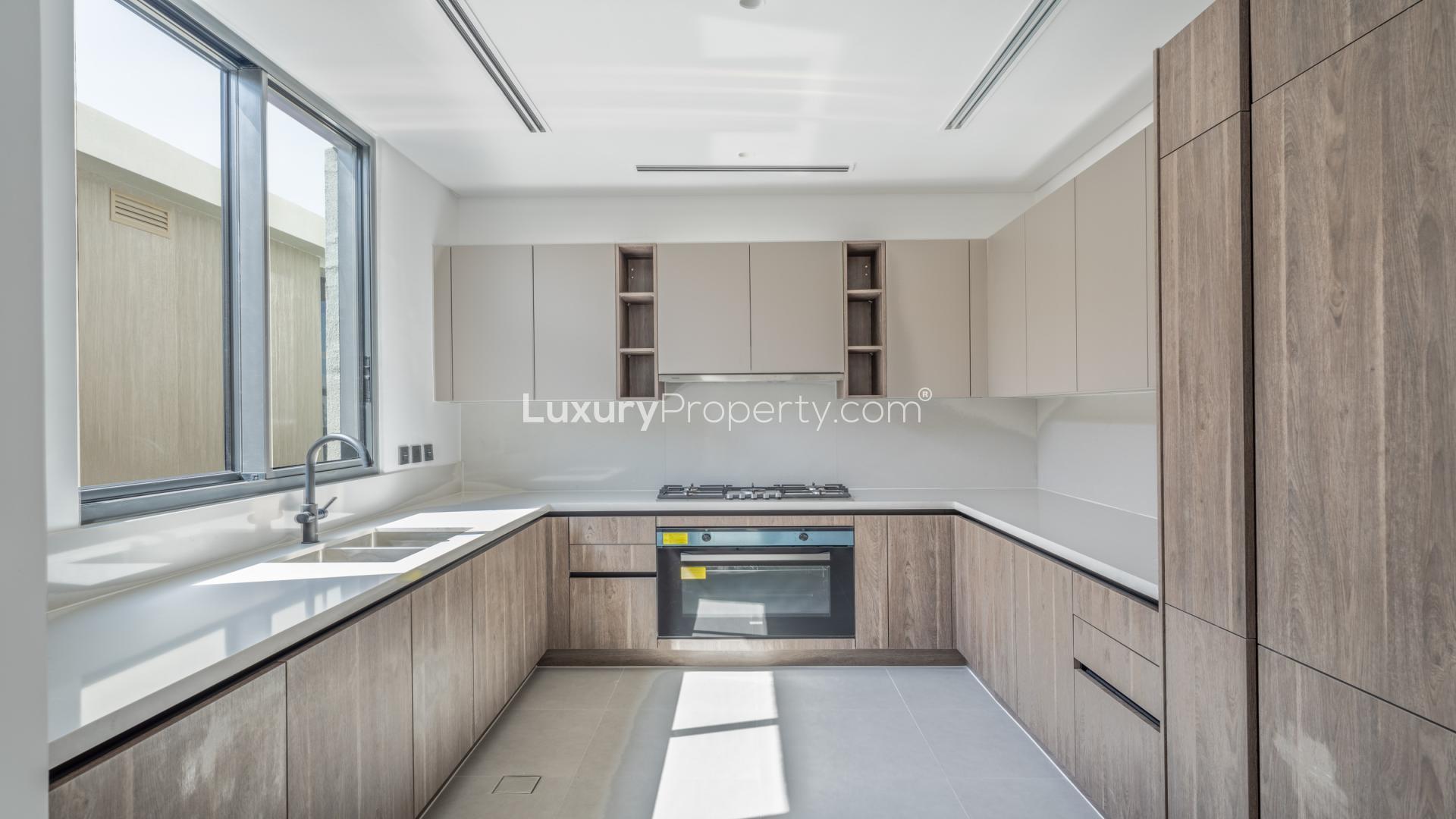 Modern kitchen in fully upgraded villa, Tilal Al Ghaf, Harmony community, available for rent