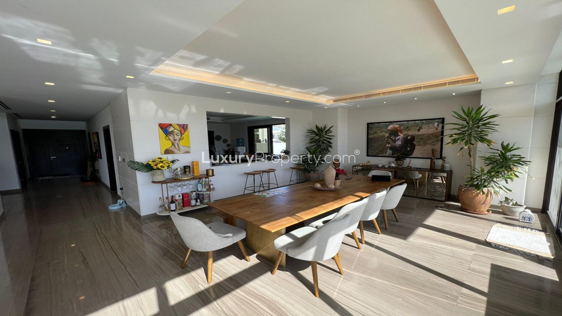 Luxurious living room in 5-bedroom villa, Trump Estates, Damac Hills, with pool view