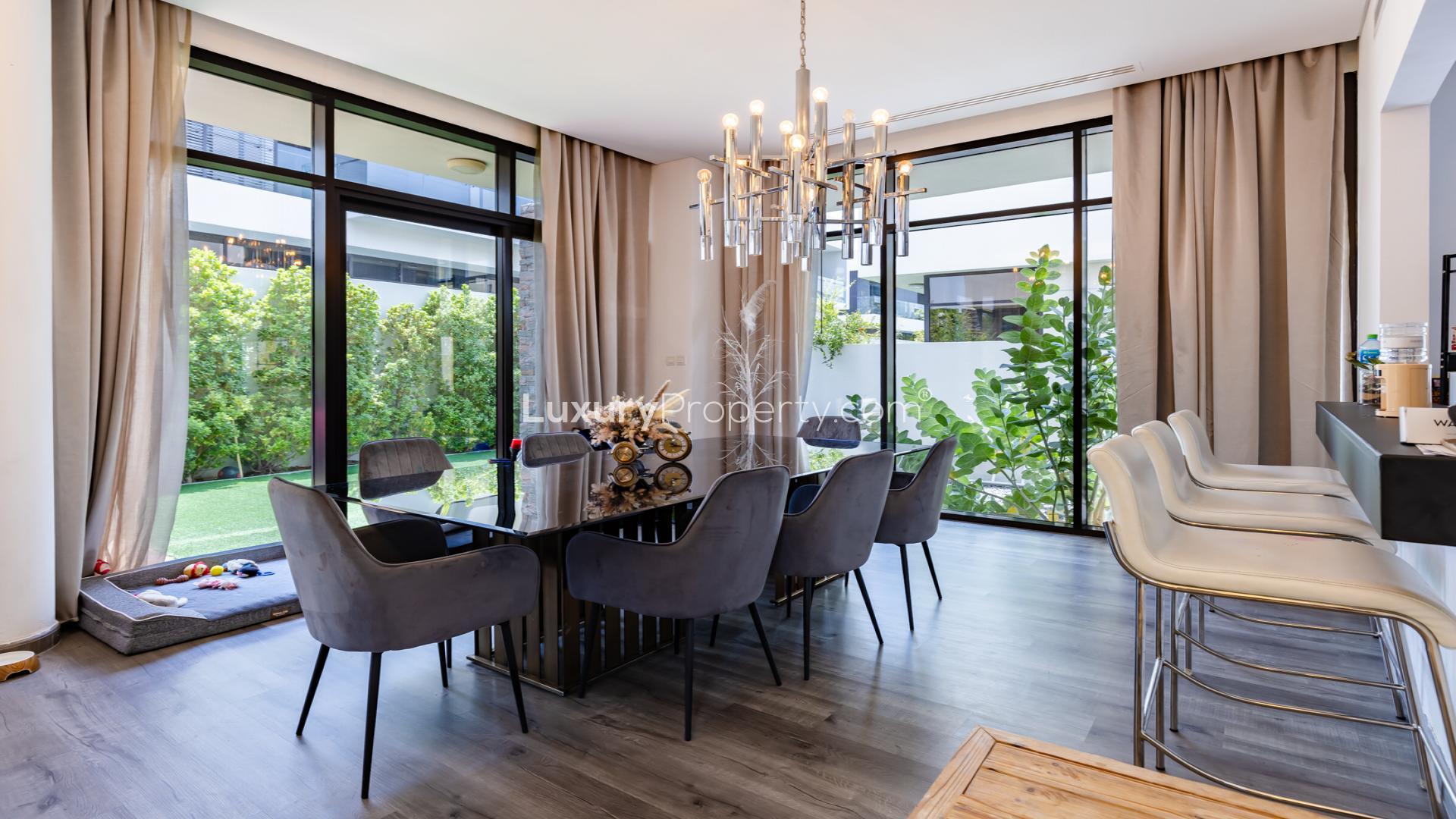 Luxury villa living room with modern sofas and large windows in Damac Hills