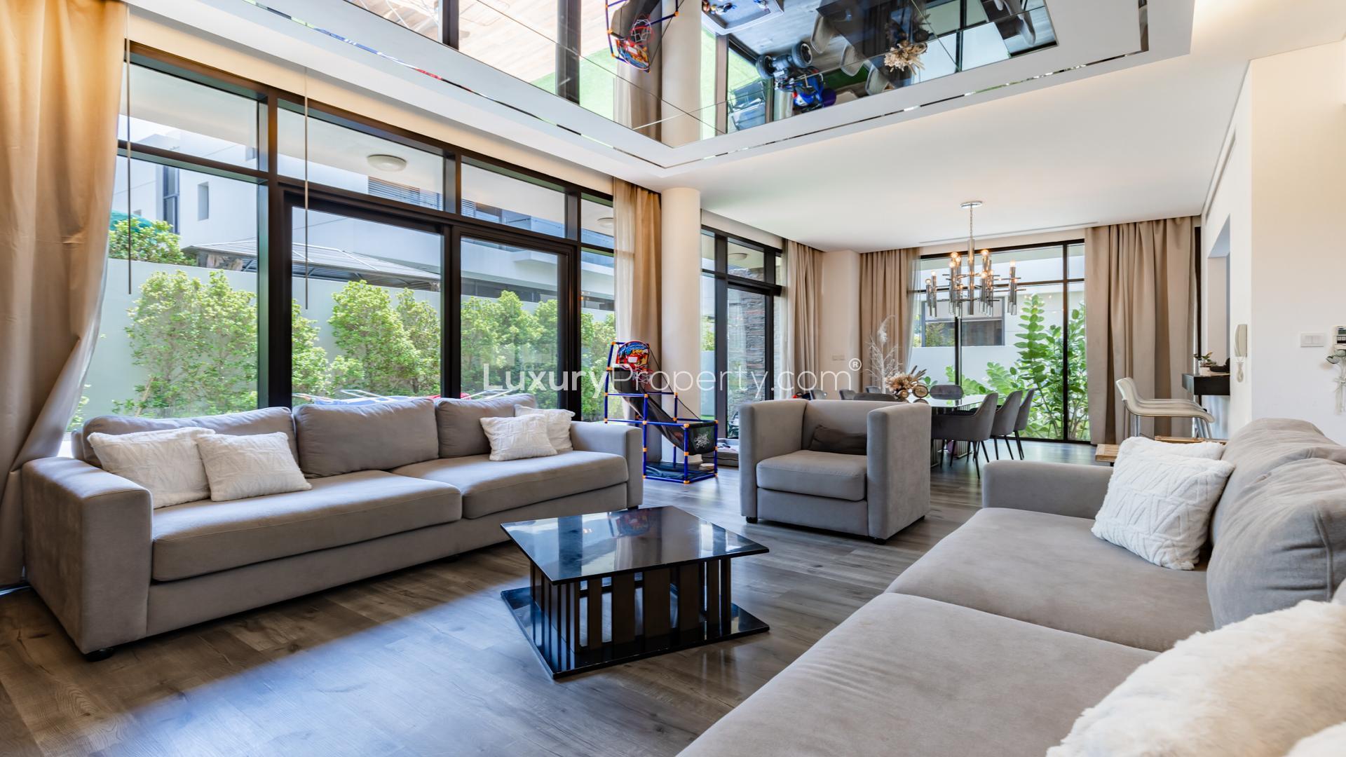 Luxury villa garden with modern patio furniture in Piccadilly Green, Damac Hills