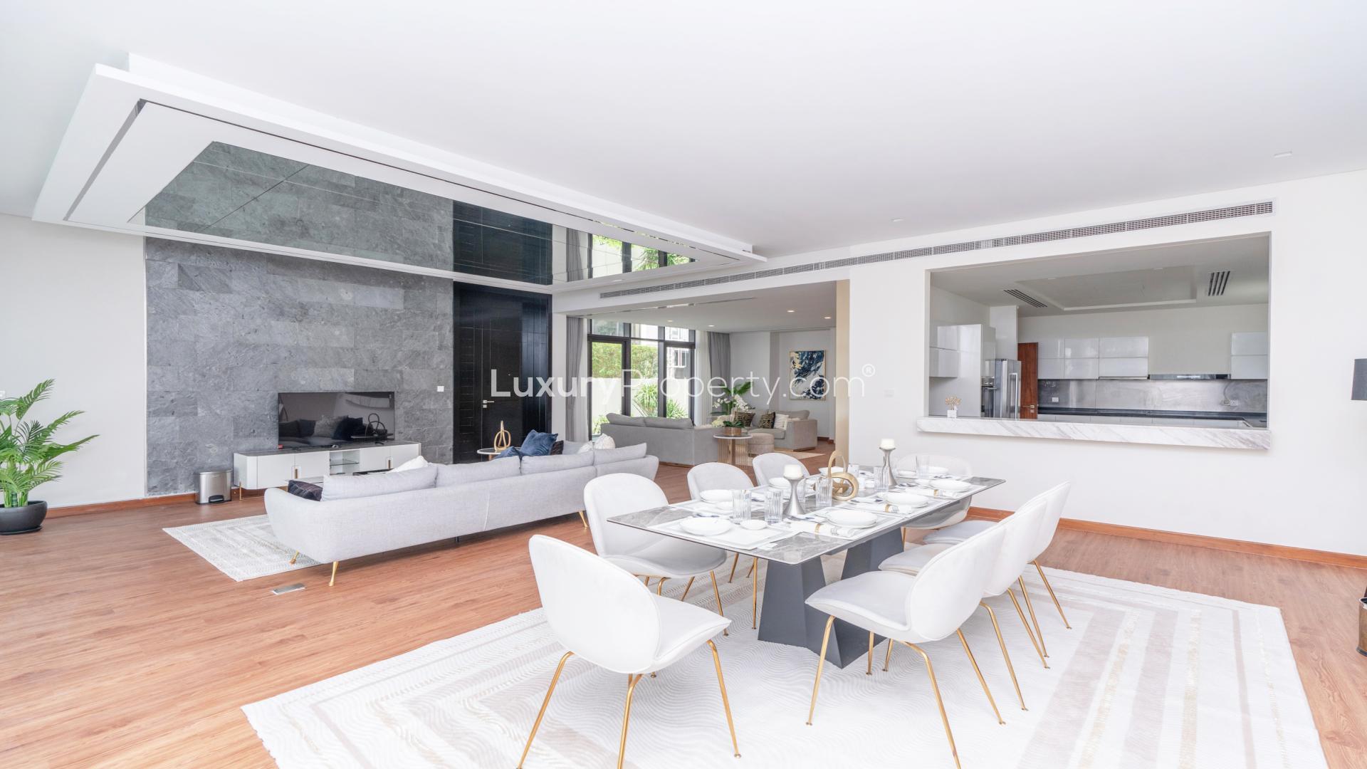 Fully furnished open-plan living and dining area in 5-bedroom villa, Damac Hills