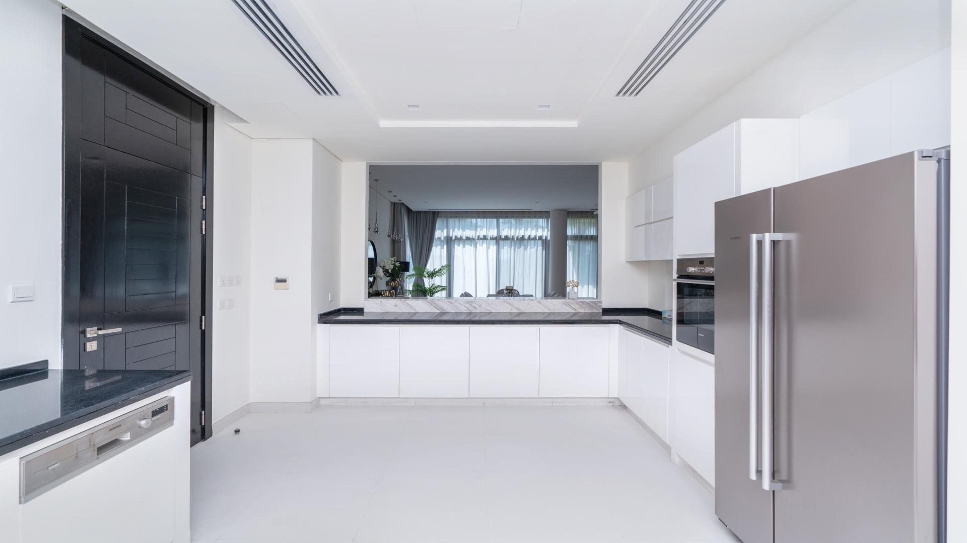 Open plan living and dining area in furnished 5-bedroom villa, Damac Hills, Picadilly Green