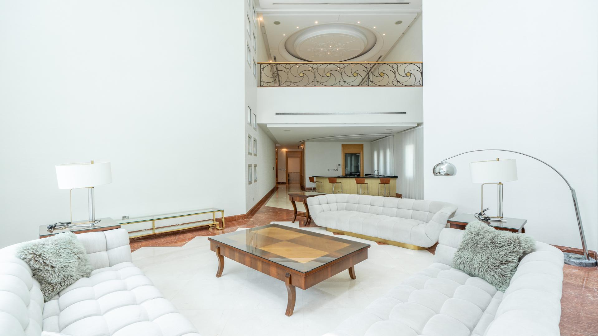 Park-facing villa exterior with lush garden, Emirates Hills, Sector P