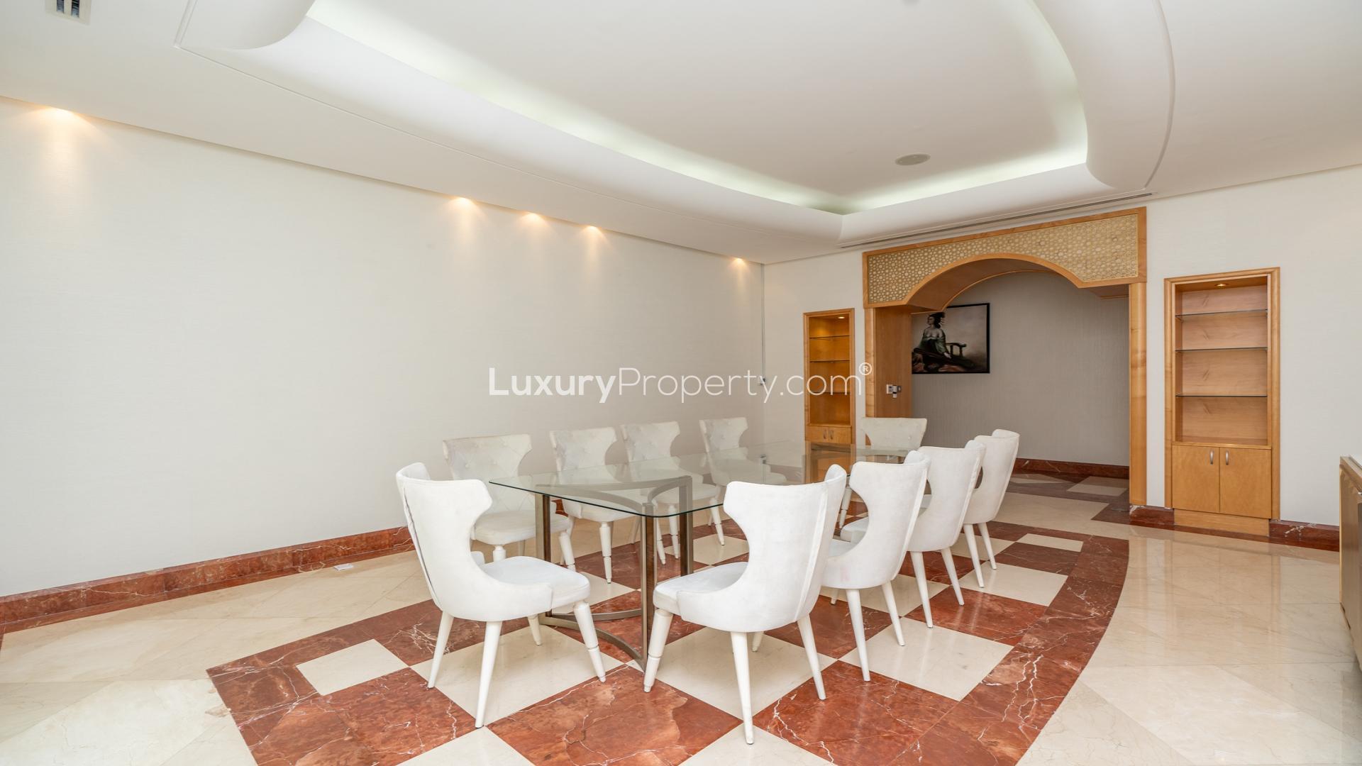 Luxurious living room in 5-bedroom villa, Emirates Hills, with elegant sofas and modern decor