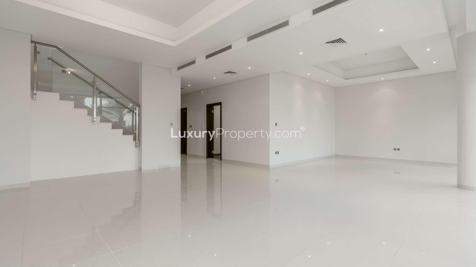 Elegant 5-bedroom villa exterior with driveway in The Turf, Damac Hills for rent