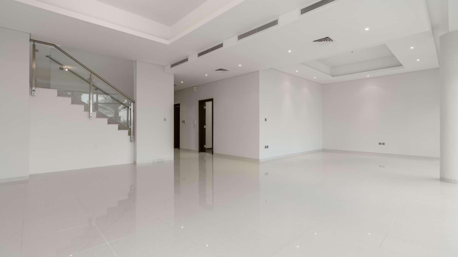Elegant 5-bedroom villa exterior with driveway in The Turf, Damac Hills for rent