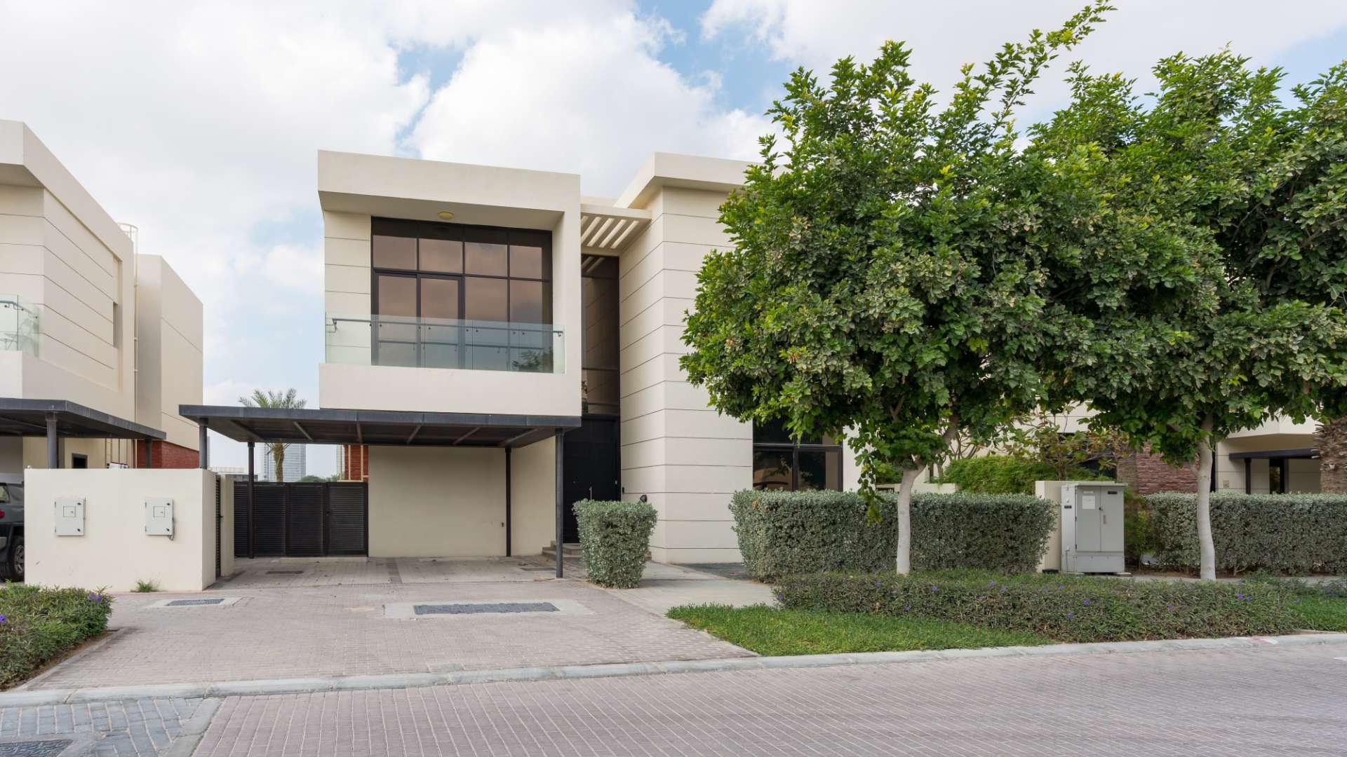 Spacious living area in elegant 5-bedroom villa, The Turf, Damac Hills, with garden view