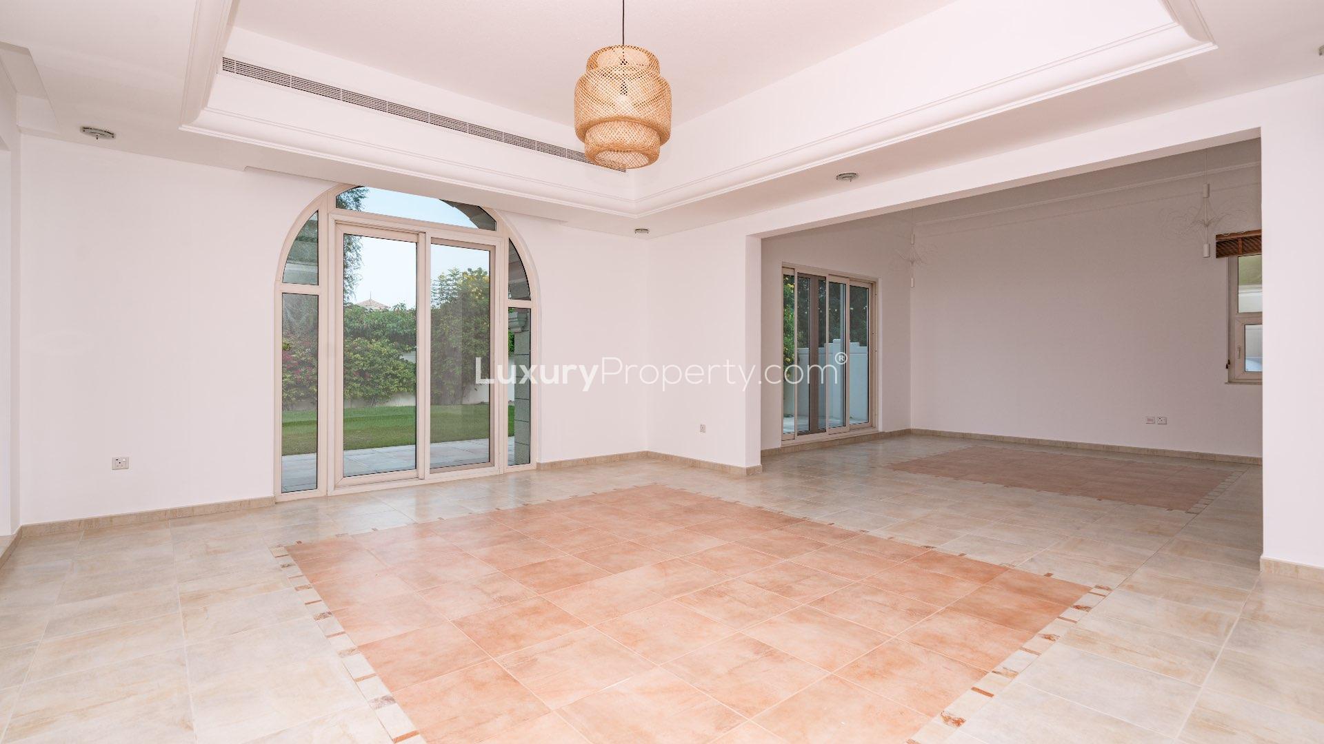 Park-facing 5-bed villa exterior in Victory Heights, Dubai Sports City, for rent