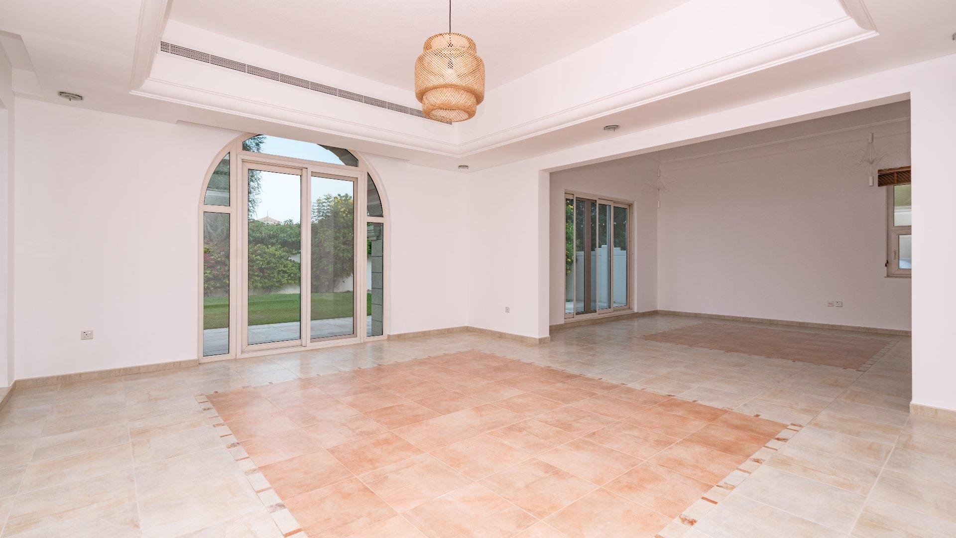 Park-facing 5-bed villa exterior in Victory Heights, Dubai Sports City, for rent