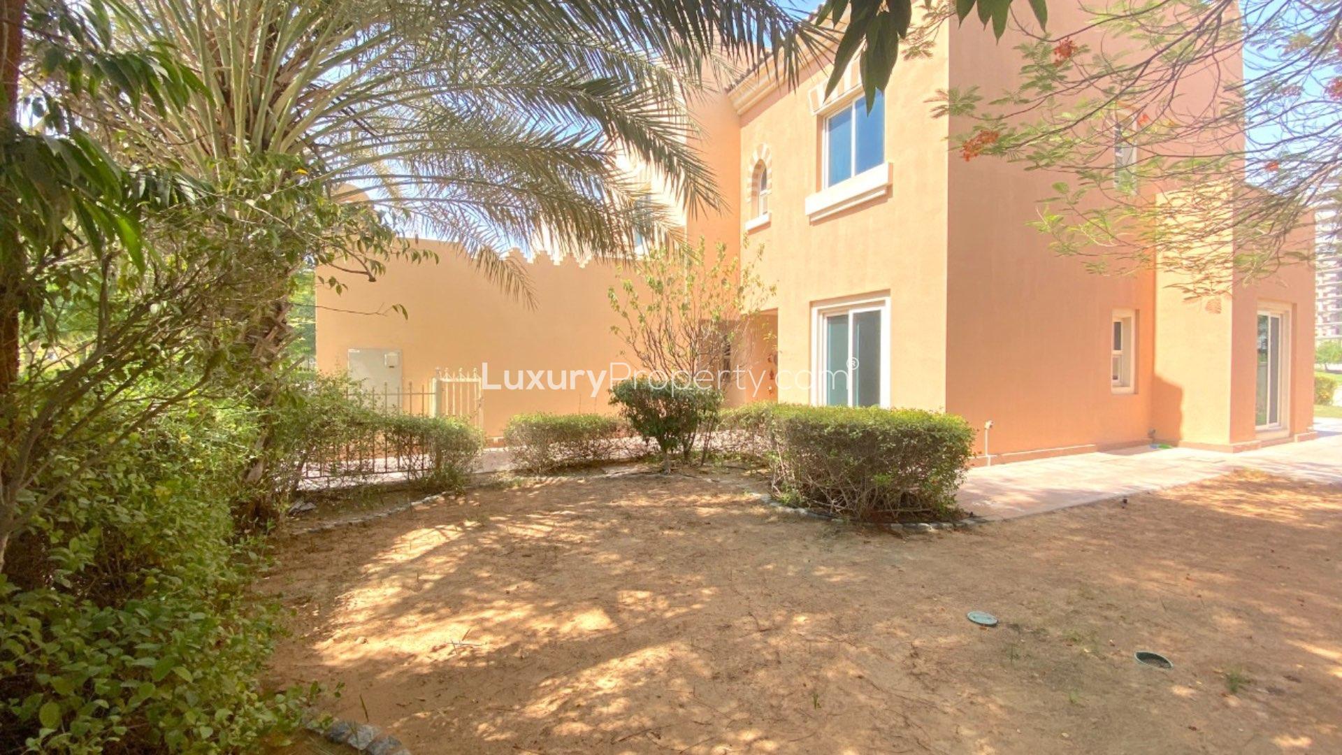 Bright living room with large windows in Victory Heights villa, Dubai Sports City