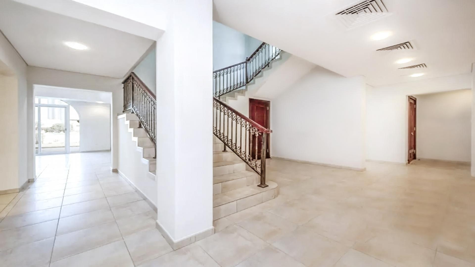 Spacious living room in five-bedroom villa, Victory Heights, Dubai Sports City, large windows, tiled floor