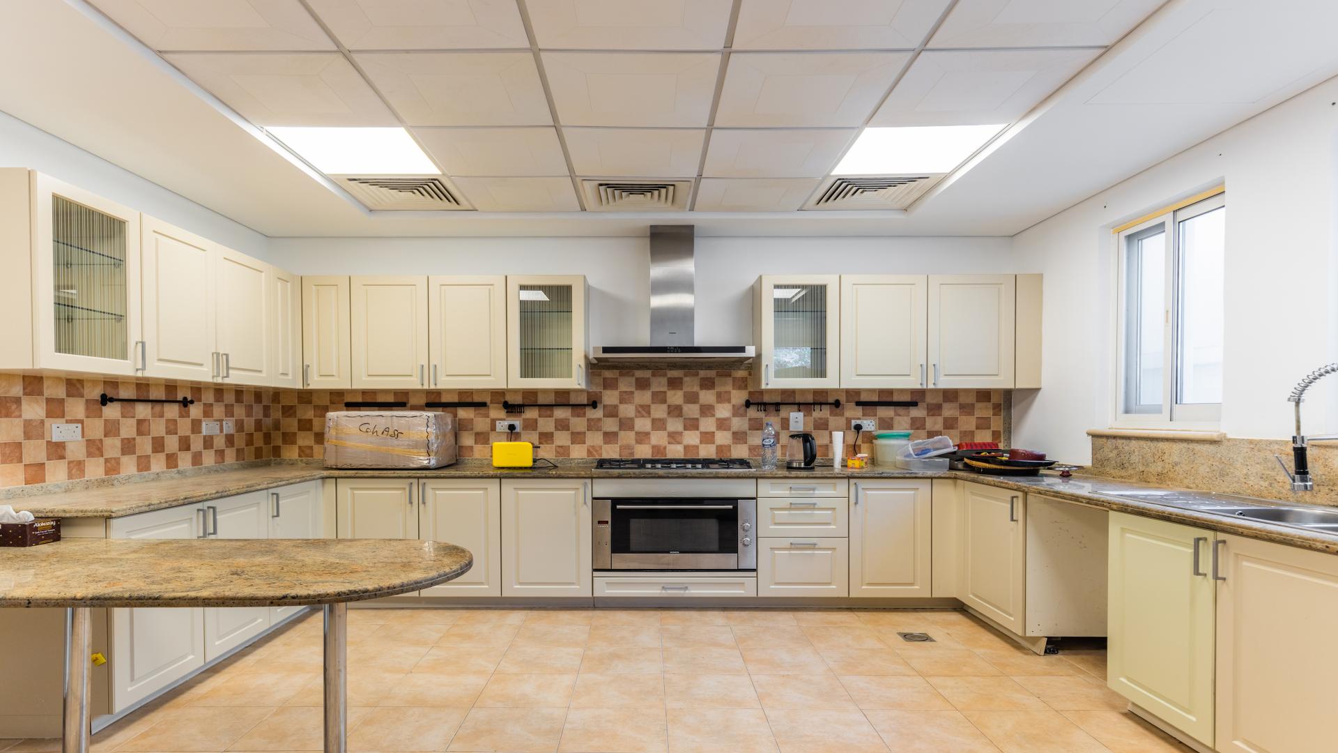 Spacious villa staircase with elegant railing in Victory Heights, Dubai Sports City