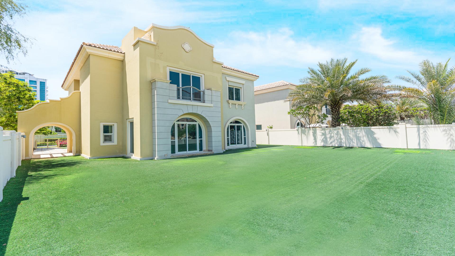 "Spacious terrace view from 5-bedroom villa in Victory Heights, Dubai Sports City.",Stunning villa exterior with spacious backyard in Morella Village, Victory Heights, Dubai Sports City