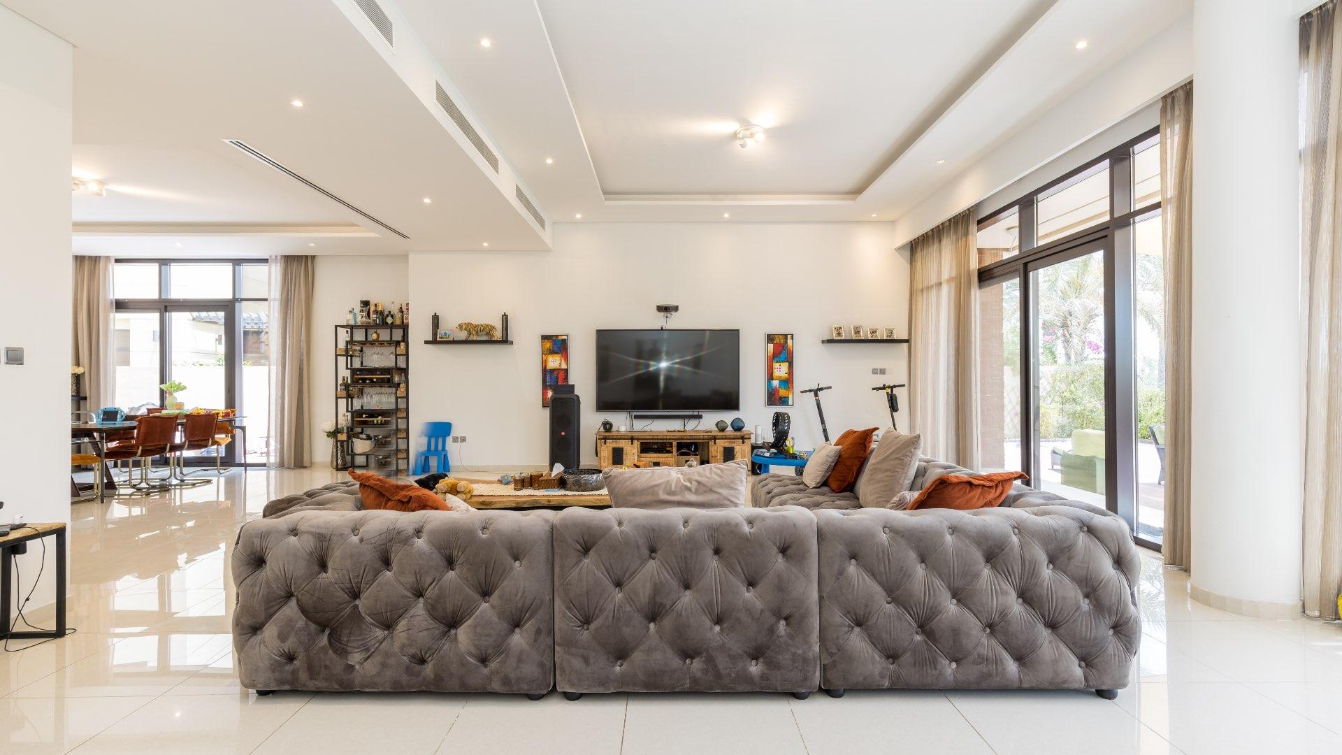 Modern 5-bedroom villa exterior with carport in Whitefield, Damac Hills, for rent