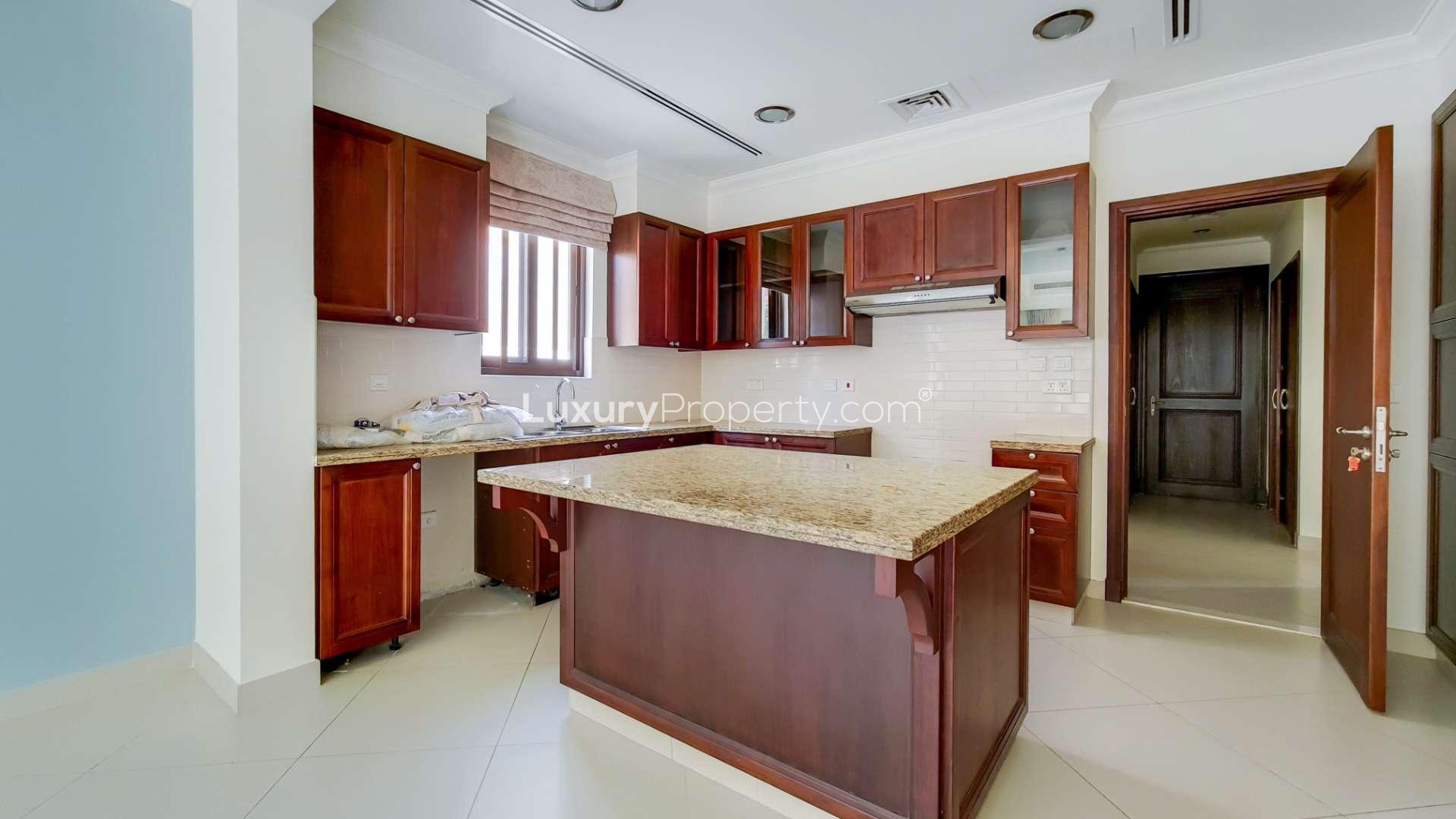 Spacious living area with modern kitchen in Yasmin Villa, Arabian Ranches 2 for rent