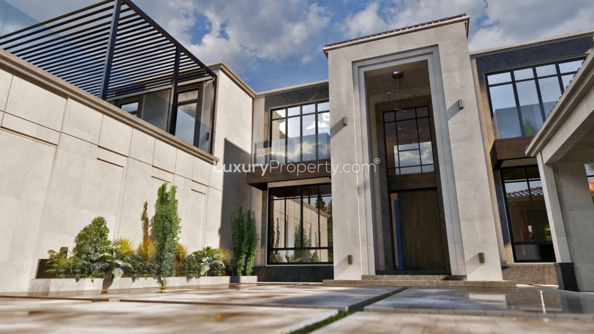 N/A,Contemporary villa exterior in Jumeirah Golf Estates, modern architecture, large windows, landscaped entry