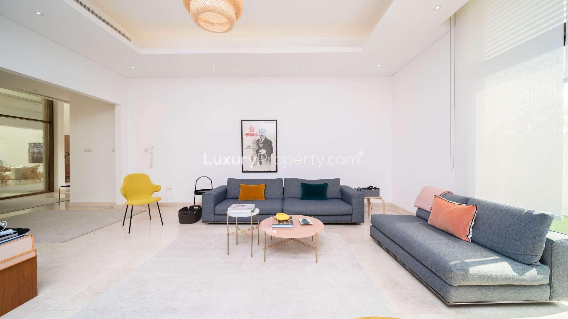 Luxurious villa entrance with garden seating in Meydan Gated Community, Millennium Estates