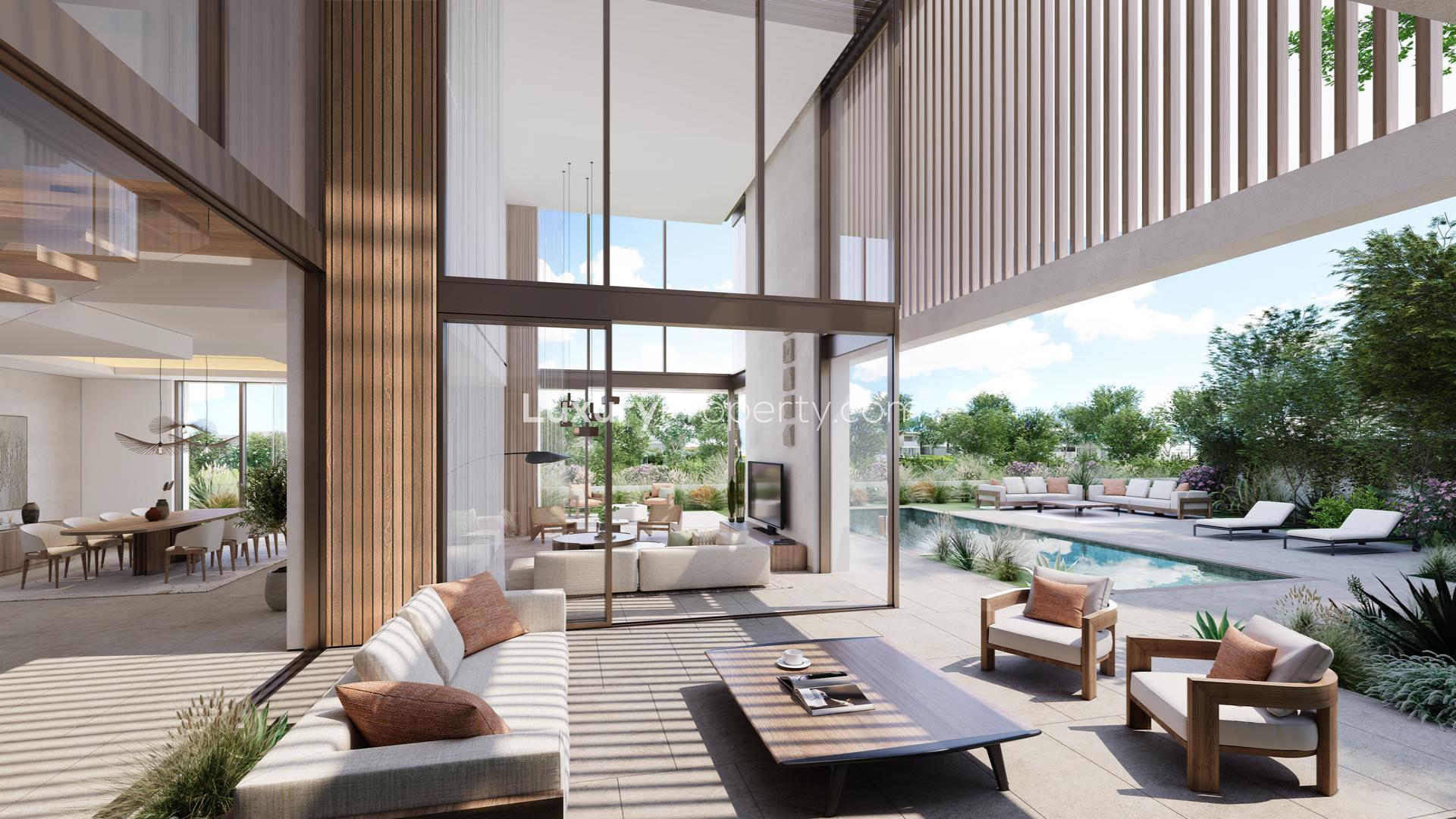 Contemporary villa in The Acres, Dubai Land, with lush landscaping and serene lake views